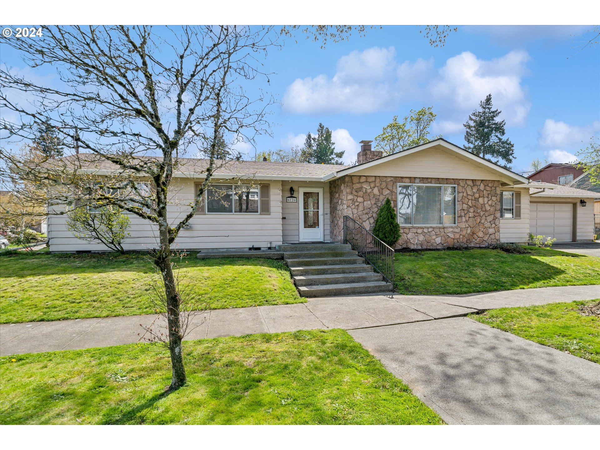Lovely one level living in this well laid out ranch. Corner lot perched nicely above the bicycle and pedestrian corridor. Oversized attached garage(500sqft) bonus covered outdoor room(10x20) [Home Energy Score = 2. HES Report at https://rpt.greenbuildingregistry.com/hes/OR10075472]