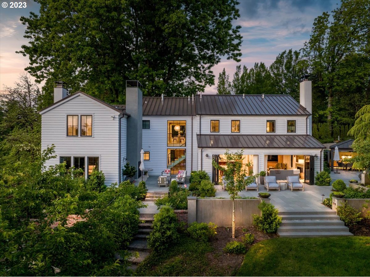 Presenting a truly remarkable, one of a kind residence, poised to redefine luxurious living in Portland. Experience unparalleled luxury with this meticulously crafted 5-bedroom, 5.5-bath estate in the exclusive Green Hills neighborhood. Completed by Green Gables, this sun-drenched home, set on over an acre of private grounds, offers a blend of privacy and exclusivity. Interior designer Lisa Staton and Emerick Architects collaborated on the breathtaking design, infusing modern elegance with timeless sophistication. This sprawling 7400+ sqft home showcases a desired floor plan with a secluded primary suite with tranquil spa-like bath, two laundry rooms, library, wine cellar, and home gym. Beamed ceilings and giant picture windows frame the stunning, lush grounds, flooding the living spaces with natural light. A generously sized gourmet kitchen with top-tier appliances, walk-in butler's pantry, wet bar, and large island, all contribute to this architectural masterpiece. Every detail is a testament to impeccable craftsmanship, encapsulating modern elegance. Whether you're relaxing in the comfort of the interior living spaces or enjoying the outdoors in the mature landscaped gardens and outdoor entertaining areas, this home offers a serene and luxurious retreat.