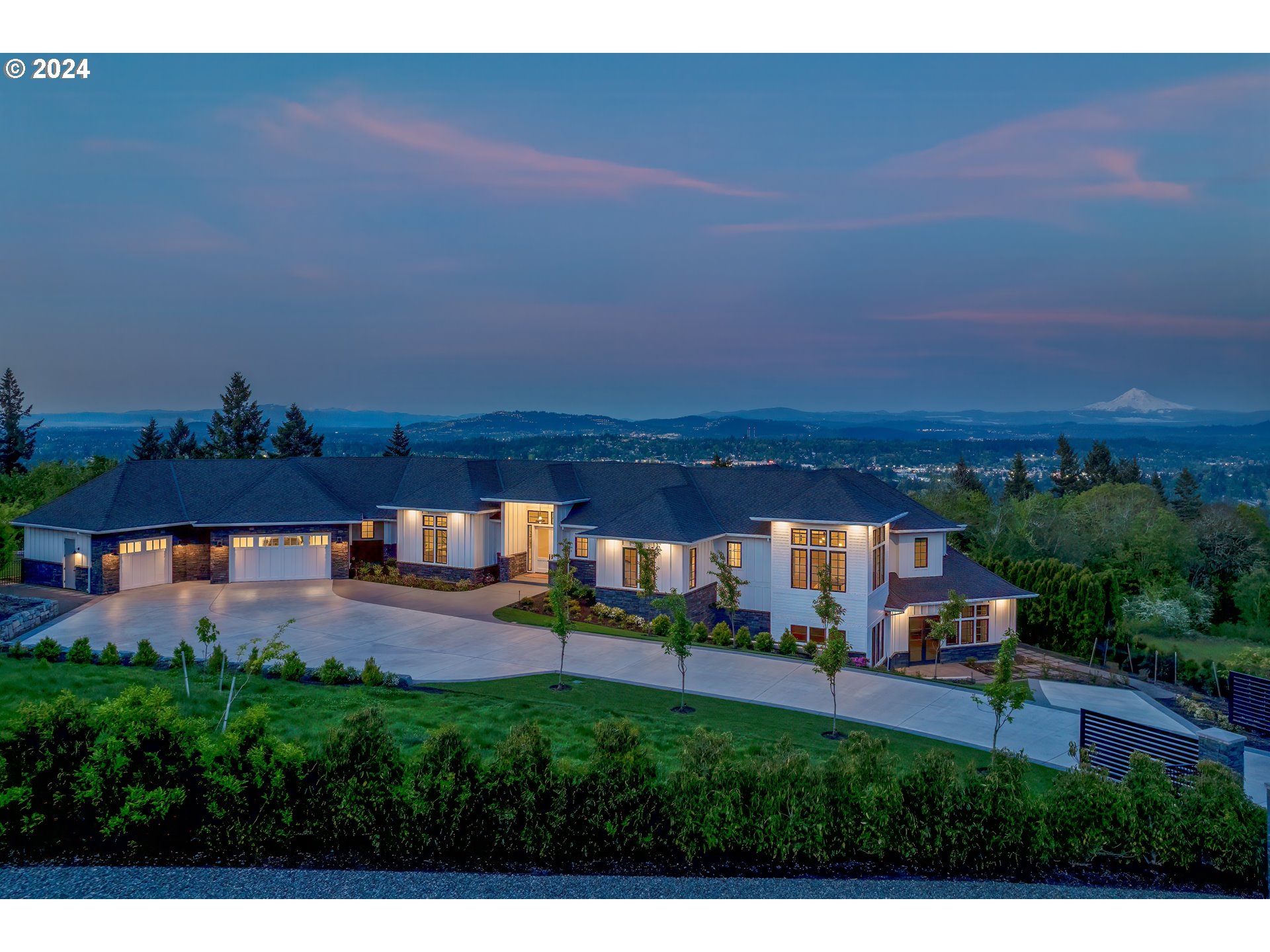 Indulge in luxury living in Lake Oswego's prestigious Skylands neighborhood, where this exquisite Contemporary estate boasts effortless elegance and breathtaking panoramic views of the Pacific Northwest's natural beauty. From the grand soaring ceilings to the expansive windows framing the view, this meticulously designed home invites you to immerse yourself in timeless elegance. Entertain in the gourmet kitchen with top-of-the-line appliances and spacious central island, while the show-stopping living room with its ceiling-height stone fireplace offers a picturesque backdrop for gatherings. Retreat to the serene, main-floor primary suite, complete with a light-filled office, gas fireplace, and spa-like ensuite bath. Downstairs, the expansive family room opens to a covered patio, perfect for outdoor entertaining year-round, while the newly installed sport court provides additional opportunities for recreation and play. With over 1,460 square feet of unfinished space, the possibilities for customization are endless. Located in the coveted Skylands neighborhood, residents enjoy convenient access to downtown Lake Oswego's amenities and highly-ranked schools.