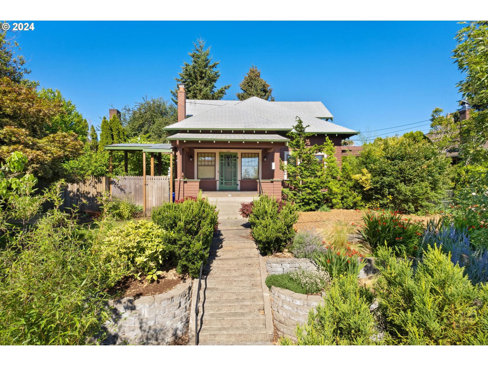 This one is truly special! An amazing opportunity to own a piece of Portland history! Perched high above the street on the 72nd greenway sits this wonderful, architecturally significant craftsman bungalow. A spectacular example of timeless design featuring handcrafted details, natural unpainted woodwork, leaded and stained glass and beamed ceilings. Show stopping formal spaces with gorgeous tiled fireplace, built-ins and French doors that open onto the large wrap around front porch for easy indoor/outdoor living. Generous rooms throughout including spacious upper level with tall ceilings, large bedrooms, huge primary closets, remodeled bathroom and fun paneled loft room. Main level bedroom and bath and versatile lower floor with outside entry. Thoughtful, period appropriate updates and the preservation of original details ensures lasting value. Enjoy the many outdoor spaces- terraced garden, private lawn, garden beds, kitchen deck and front porch. Fencing and mature plantings on all three sides creates a beautiful buffer from neighboring properties. Awesome Roseway location close to fun and convenient amenities on Sandy and Fremont- Fresh Love smoothies and sandwiches, Otto's pizza, Upright Brewing and Juniors Coffee just a stroll away plus all of the essentials nearby- grocery, hardware, banks and pharmacy, etc. [Home Energy Score = 5. HES Report at https://rpt.greenbuildingregistry.com/hes/OR10079582]