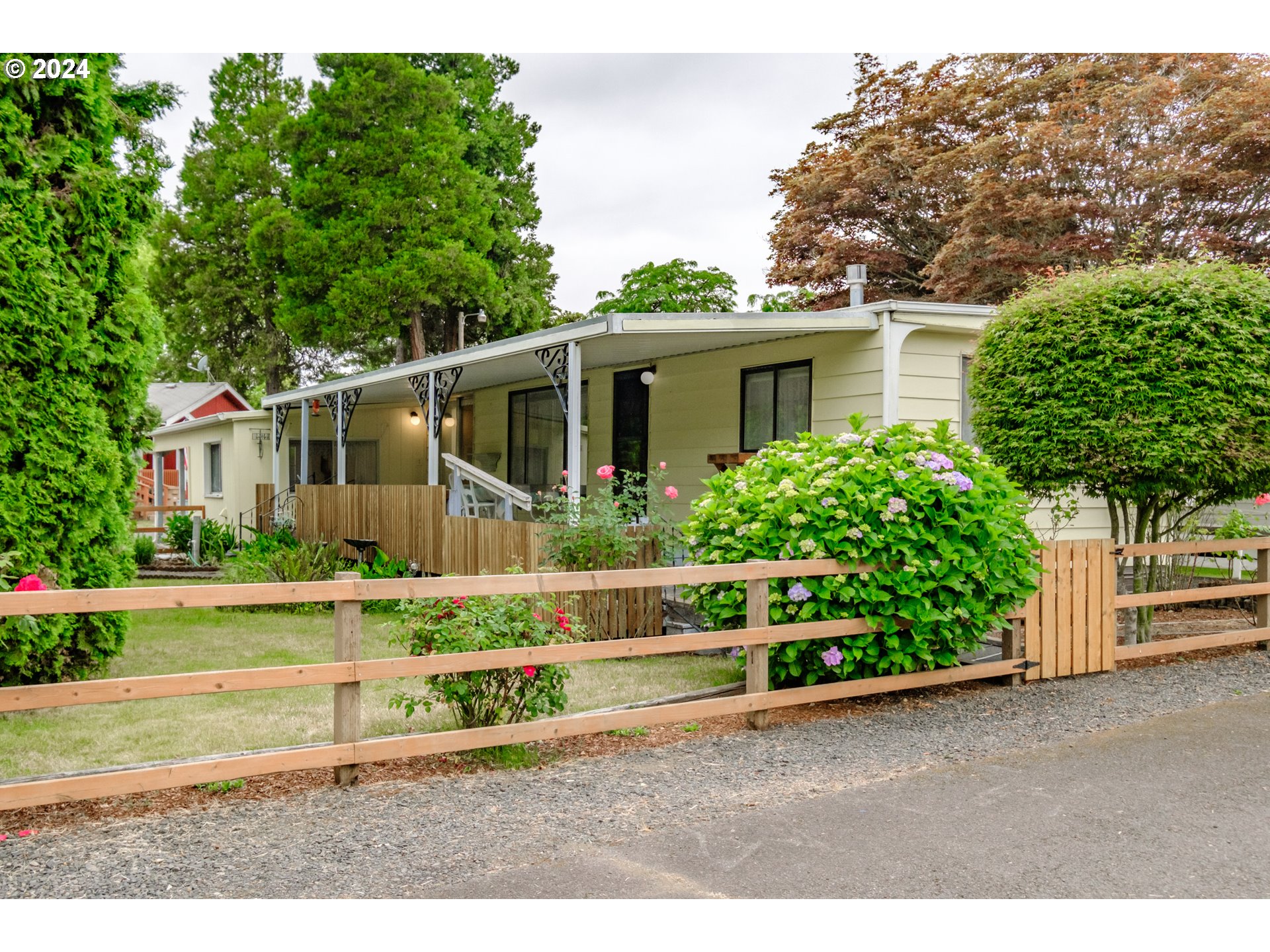 Enjoy small-town life in the lovely Brownsville Mobile Home Park with views of grassy fields and trees. This 2 bedroom, 2 bathroom home has only had 2 owners and you will love how well it has been kept up. The 2 bedrooms are on opposite sides of the house, providing great separation of space. The large covered deck is ideal for hosting gatherings and soaking in the private surroundings and beautiful garden. Use the extra large shed as storage or as a workshop for your hobbies. Call today to schedule your showing. Buyers must be approved by the park owners after an accepted offer and pass all required applications and background checks. Space rent is $589 per month, not including utilities. Cash only.