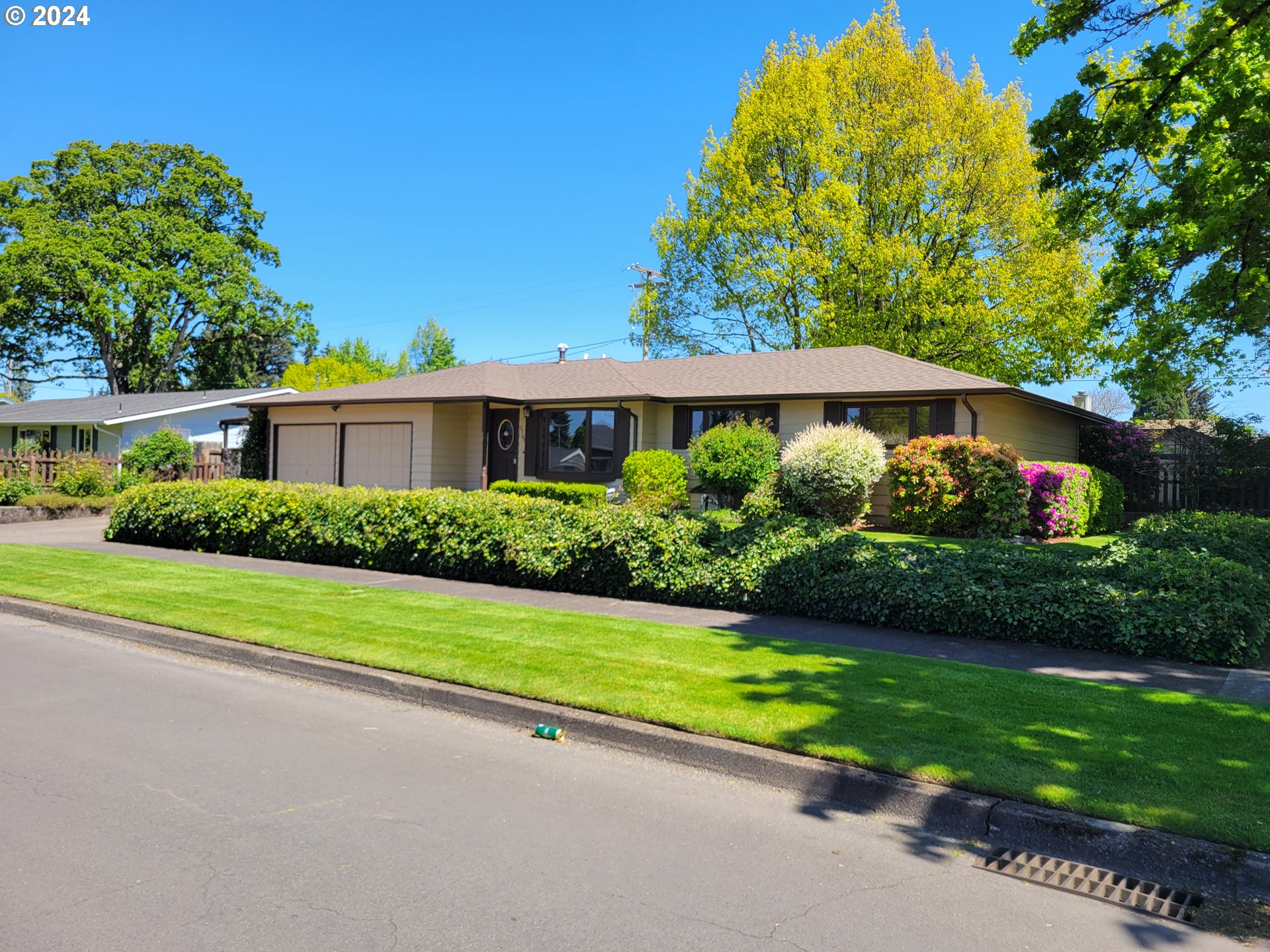 Gardeners delight with this corner lot in a desirable River Road area. First time on the market for this very impeccably cared for home. Nice separation of space with multiple family areas. Large Primary at opposing side of other bedrooms. Primary has own bathroom, large walk-in closet and fireplace. Bonus 10'x16' hobby outbuilding with heat/ac, power, and lights, plus 10'x8' tool shed. Landscaping is absolutely stunning. You will feel like you're in a park in your own backyard. There is an Irrigation well to help keep it looking beautiful year-round.