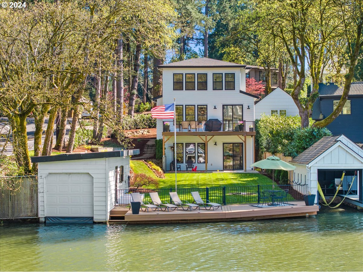 Like new construction on Oswego Lake's coveted West Bay. A very well appointed transitional style home with a flexible floor plan on a large level waterfront yard. Great room concept with main floor office/den, large primary suite with spa like bath and generously sized walk in closet; 2 other guest rooms on the upper level. The lower level houses the perfect bonus room with ready to add bar, guest room and massive conditioned flex/storage room-this space is perfect for a home gym, additional bedroom, wine cellar, shop or anything one can imagine. A rare "move in ready" Lake Front home just in time for summer and the 4th of July!