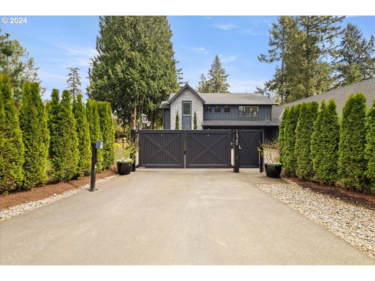 Private oasis in the heart of Lake Oswego. A true masterpiece with gate secured entry and upgraded turf back yard. This home has it all; great room/open concept, entertainers kitchen with planning desk and walk in pantry, large heated covered outdoor patio which enhances the size and livability of the great room/entertaining area; the main floor offers a guest suite and two dedicated offices/flex spaces as well a mudroom off of the 3 car garage. The upper floor houses the Owners Suite with spa like bath and oversized walk in closet, 2 generously sized guest rooms and a family/TV room. The driveway acts like a courtyard or sport court, the fully fenced back yard is bigger than it appears with a paver patio, putting green and raised bed planters-at night the yard comes to life with landscape lighting. The property has deeded access to Goodin, Springbrook and Summit Court lake easements.