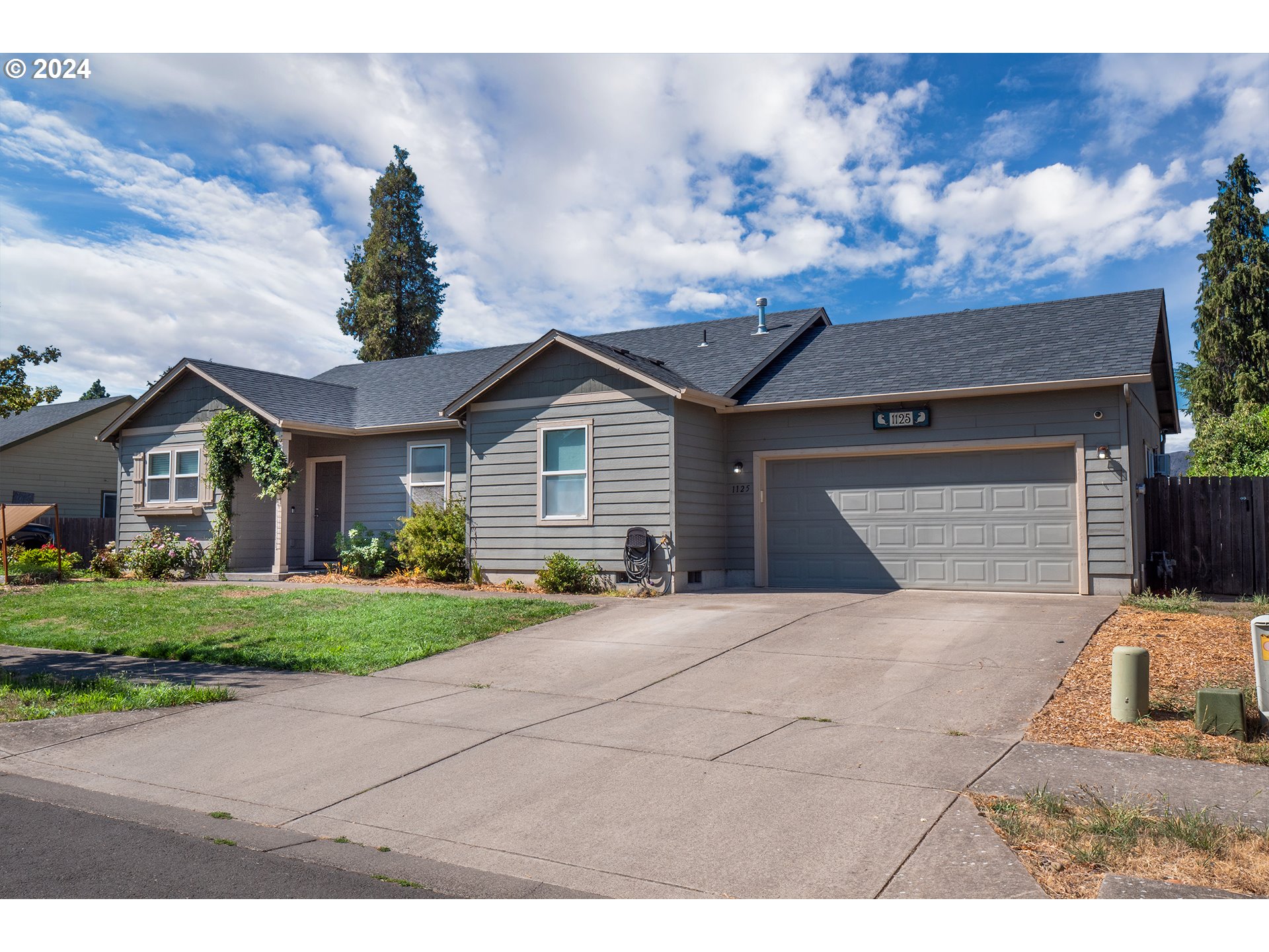 Welcome home to your turnkey paradise! This wonderful 2013 built home with the perfect combination of 3 beds, 2 baths and 1403 square feet are ready to go with updated flooring, paint and more! Stainless steel appliances, granite countertops, warm wood cabinets and high ceilings create a joyful and serene space by your gas fire. Enjoy the low maintenance backyard and garden to hearts delight with an array of plants, roses and fruit. Share good times with your neighbors with the amazing pull down bar fence. Garage/shop has permitted sink hookups, built in AC units, extra refrigerator, possible extra bedroom or rental with separate entrance! Everything has been gone over and this home is ready for you to add your unique touches or just enjoy it everyday. Schedule a tour with your agent today!