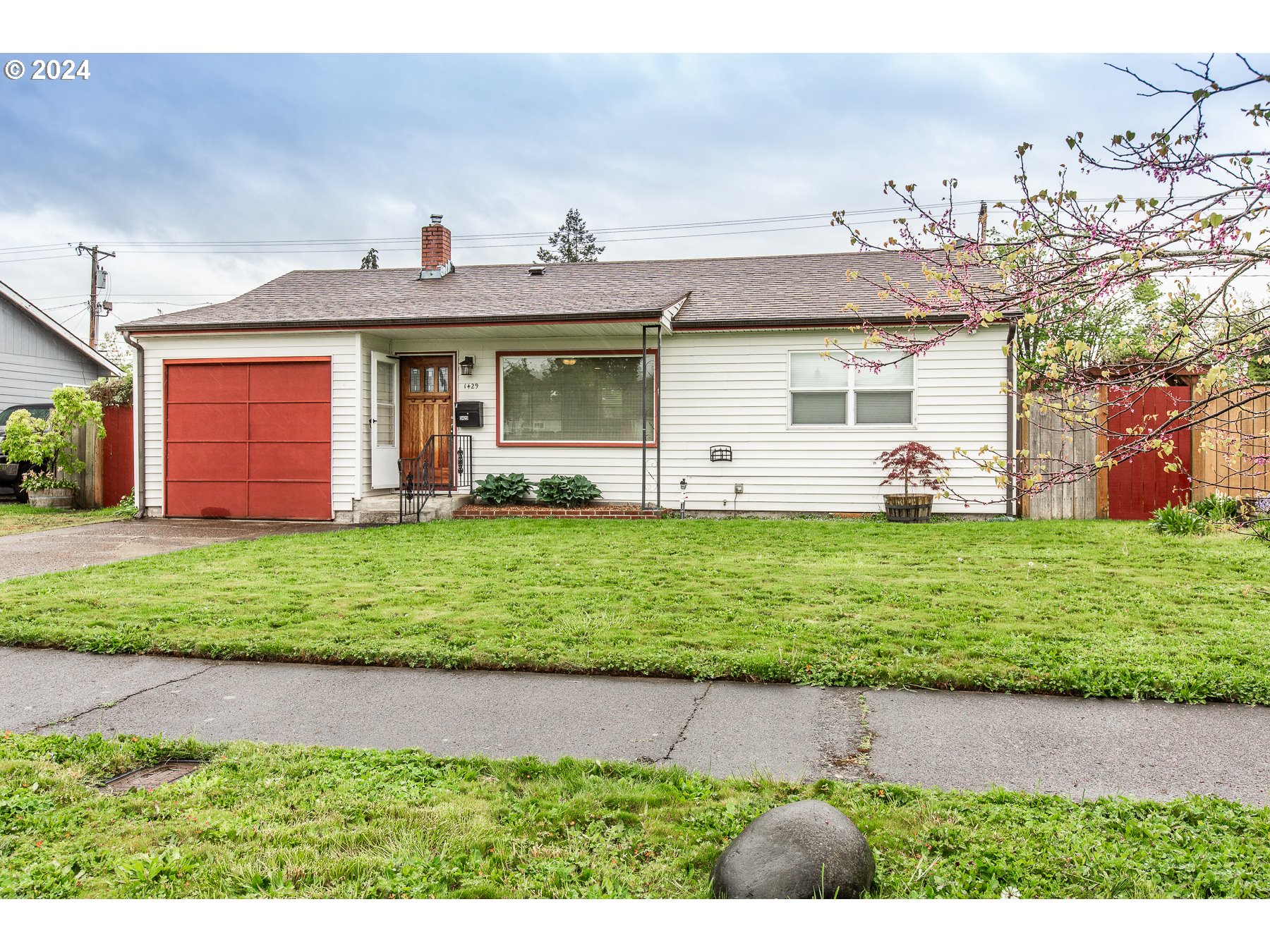 Open concept and beautifully updated kitchen with space for table/eat area. Bathroom is light filled with exquisitely tiled shower.  Large deck outside is freshly stained. Yard is fenced located off the kitchen for easy access. Full Laundry room with shelving.