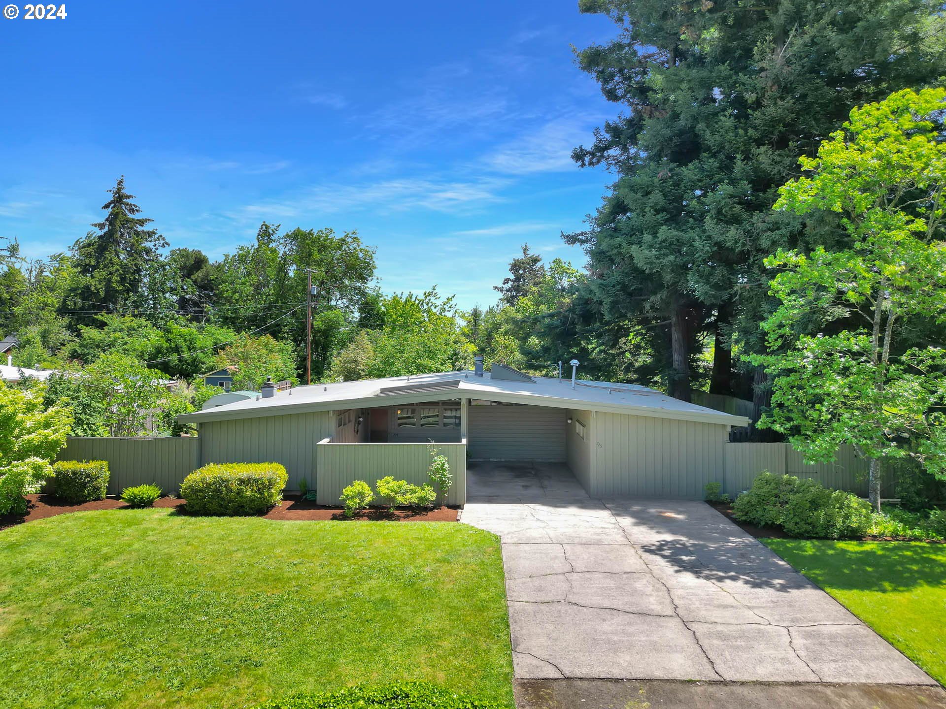 Seller to contribute $15,000 towards closing costs. This simply beautiful Mid Century Modern NW Contemporary designed in the Cliff Mays Style, has kept its charm throughout time.  Everything about this home is carefully and intentionally done with an artist's eye.  The original hardwood floors and open beam ceilings bring warmth, richness, texture, color and style not often seen.  The floor-to-ceiling windows and open floor plan will delight.  The garage conversion (done prior to 1967) is currently used as a family room with laundry and utility room.  This space has potential for a second bath and generous 4th bedroom.  Per the City of Eugene the lot is a candidate to be split with a panhandle or built on per the middle housing guidelines (buyer to due diligence) or build your dream shop/ADU.    The outdoor space on this large .37 acre lot has a separate fenced garden area that has been treasured by many.   This home will easily be kept cozy and warm efficiently as it includes a double-sided wood fireplace, both a gas wall furnace and radiant heaters powered by a traditional gas boiler updated in 2019.  Additional updates include: roof 2020, sewer lines 2015, electrical panel 2015, kitchen windows Renewal by Anderson 2020, bathtub and surround 2023 and new slider in 2024. Neighbor schools that are highly sought after include Holt, Monroe, Sheldon and St Paul?s  Don't miss this easy-to-see home.