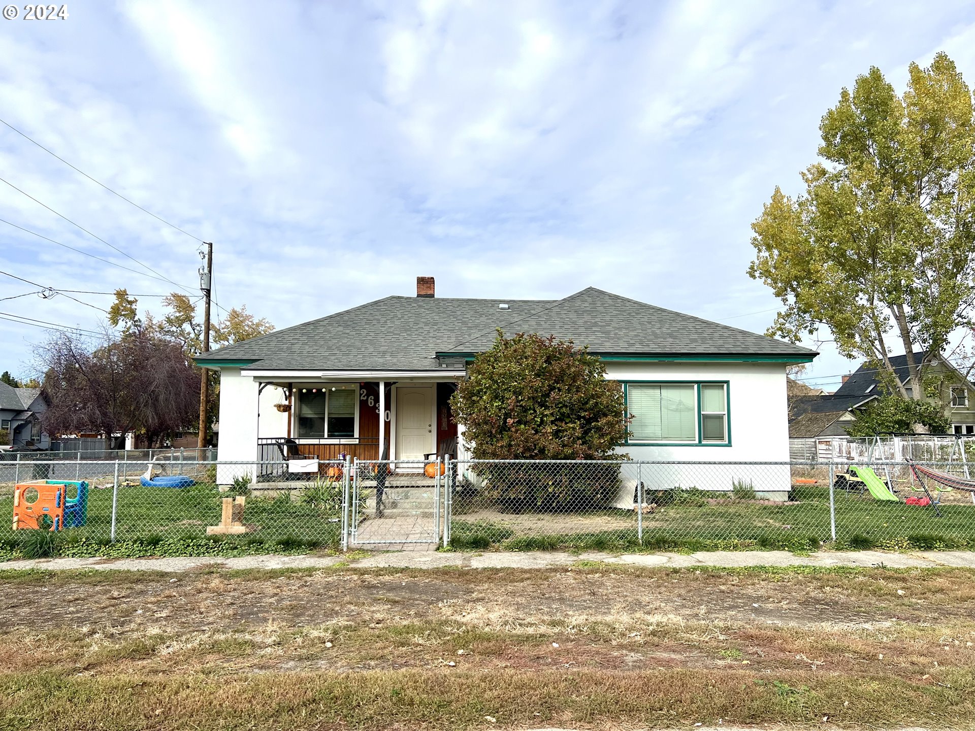 Charming 3-bedroom, 2-bath home situated on a spacious corner lot in a quiet neighborhood of Baker City. This delightful residence boasts recent updates, including fresh flooring throughout and a newer roof. The home retains its unique character with whimsical built-in cabinets and original carpentry details that add a sense of warmth and personality. The kitchen offers ample cabinetry, and the light-filled living spaces create a welcoming atmosphere.The exterior features a large, well-maintained yard with plenty of space for gardening or outdoor activities, plus a brand-new shed for extra storage or workspace. The recently installed hot water tank ensures modern efficiency and comfort. Conveniently located near schools, parks, and local amenities, this home offers both classic charm and modern convenience. A perfect option for first-time homebuyers, investors, or anyone looking to enjoy the serene pace of life in Baker City. Don’t miss the opportunity to make this gem your own!