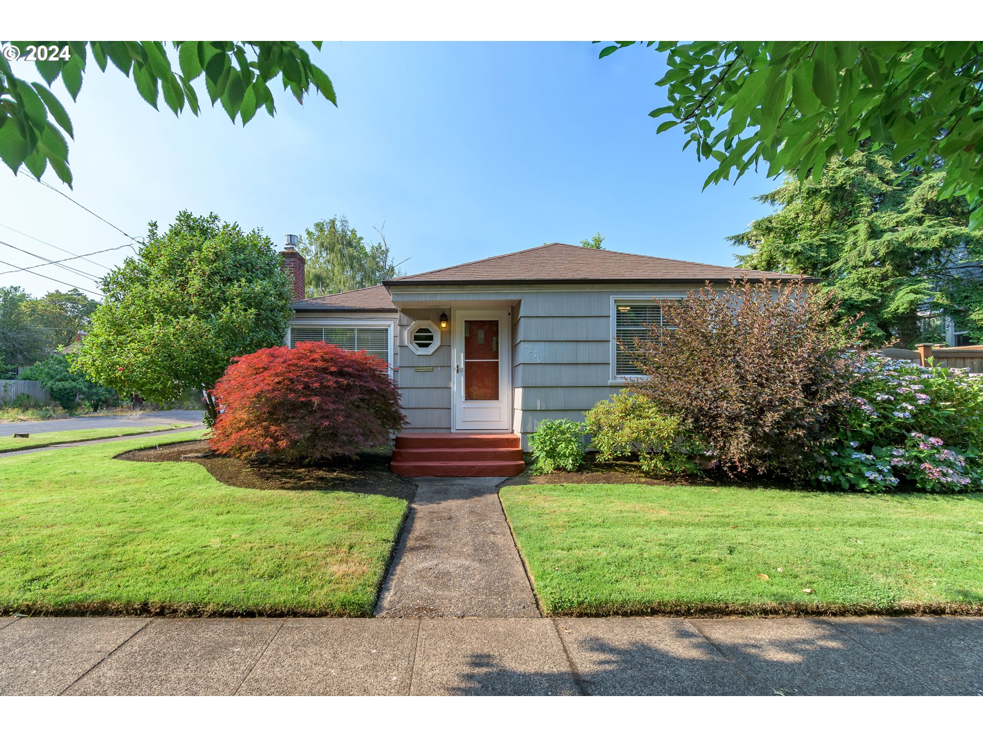 Charming, Move-In Ready Bungalow in Super Sweet Neighborhood! With an open & airy floor plan that feels larger than its size, this special home has been immaculately maintained & upgraded over the years. Features include beautiful hardwood floors throughout, updated kitchen w/ newer appliances (Fisher & Paykel fridge & dishwasher), cozy living room with gas fireplace insert, 2 spacious bedrooms, updated bathroom w/ cast iron soaking tub, and lots of built-ins.  Also offers a convenient mudroom w/ shower, sink and newer Electrolux washer/dryer; solar tube; tankless water heater; new lighting on dimmers; vinyl windows throughout; central heat & AC; and an insulated/drywalled garage w/ new ductless heat pump that makes for a perfect exercise room but also still works for parking & storage. Sited on a corner lot with underground sprinklers, you'll love the nicely landscaped front yard and the cutest fenced backyard w/ slate patio. Plantings include Japanese maple, camellias, lilies, poppies, and other ornamentals. Perfect central location for walking & biking, close to parks & restaurants, and only 2 miles to UO campus. Recent inspection on file, home is in great condition overall.
