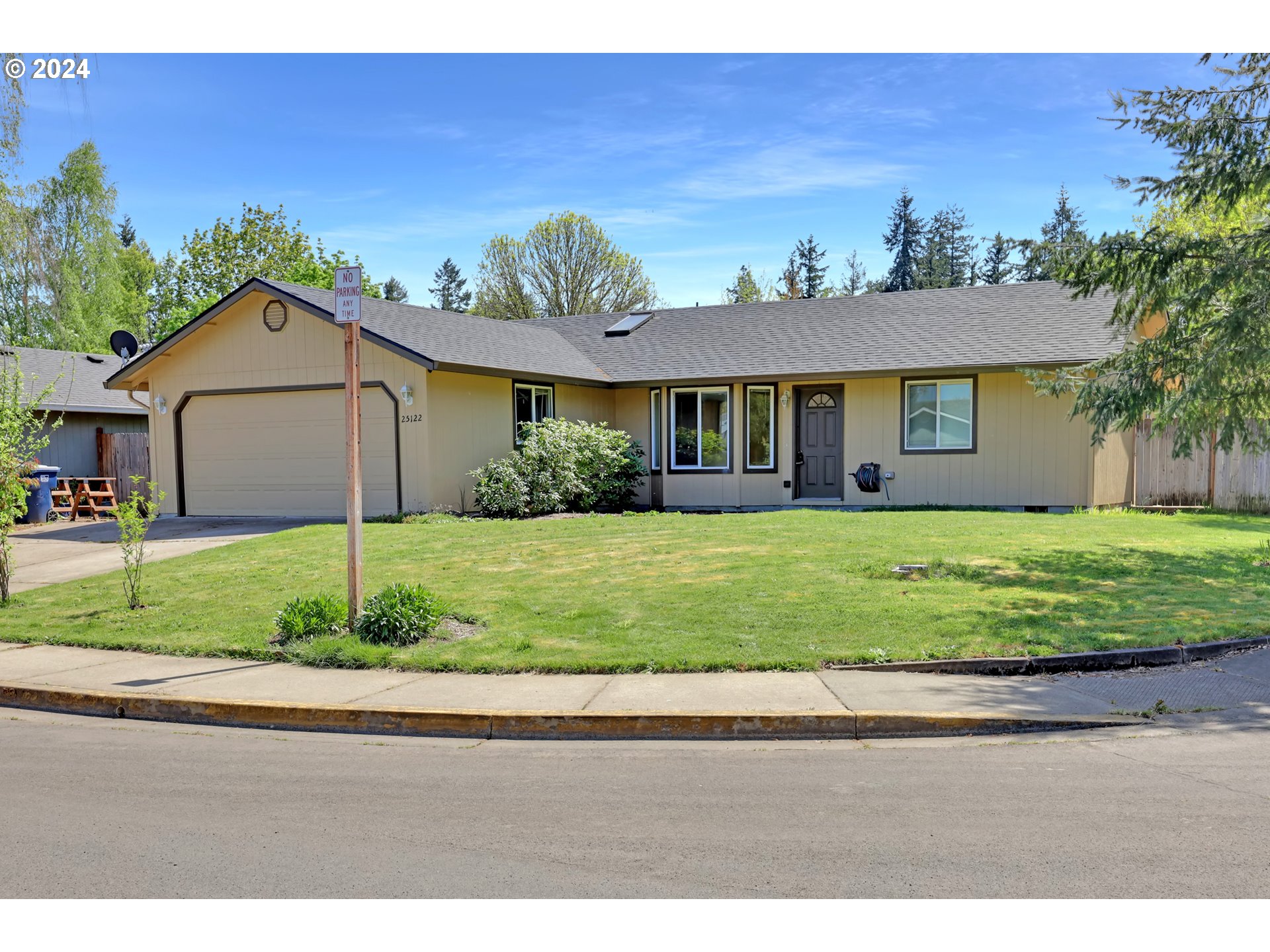 Looking for a fantastic single-level home? This home offers a  large living room with vaulted ceilings, 3 bedrooms and 2 baths with the primary suite on one side of the home providing a nice separation and privacy. Home was recently  painted both inside and out,  new roof and heat pump replaced in  2023.  The 2-car garage and a corner lot location offers convenient parking space. Also,  a well-landscaped yard with a large back patio that creates wonderful outdoor spaces for relaxation and entertainment.