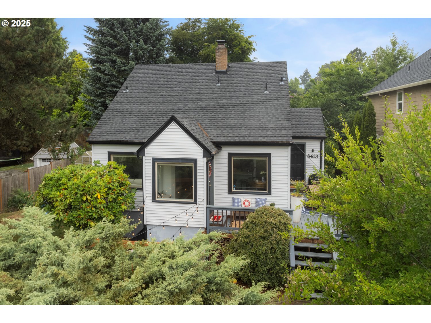 This charming English-style cottage sits above the quiet treelined street and blends timeless character with thoughtful modern updates. The main level offers two bedrooms and a beautifully updated bath, with hardwood floors and a remodeled kitchen that blends function and style. Off the kitchen, you’ll find a flexible space perfect for an office, mudroom, or creative nook. Upstairs is a spacious primary suite. The large basement boasts high ceilings and loads of potential—whether you’re dreaming of a home gym, play room, or additional living space. Recent upgrades include a furnace, water heater, plumbing, electrical panel, windows,and so much more. Outside, the landscaped yard and new patio are ready for summer hangs, morning coffee, or peaceful evenings. A rare blend of charm, privacy, and possibility. This home is a true sanctuary in the city, come see before it's gone! [Home Energy Score = 4. HES Report at https://rpt.greenbuildingregistry.com/hes/OR10007377]