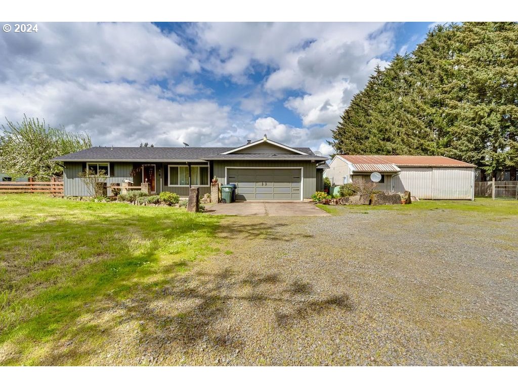 Quaint Fall Creek location off the Pengra Covered Bridge, this property features superb living spaces like a large, bright, window-filled family room with a certified woodstove and covered patio and firepit. Lots of flexible, separate space for dining room, office/den, or potential for a third bedroom. Primary bedroom has its own bathroom. Laundry room is inside the house. Washer and dryer, play structure, and chicken coop stay. The almost 3 acre level lot has plenty of RV and vehicle parking, a barn, and pasture. Giant, deluxe workshop has tons of potential with tall ceilings, banks of electrical outlets, ductless heat pump, engine hoist and storage loft. High speed internet available. 2020 home inspection described roof as "newer", and septic, well flow and water quality reports were excellent. If country living is your idea of paradise, come see this property!