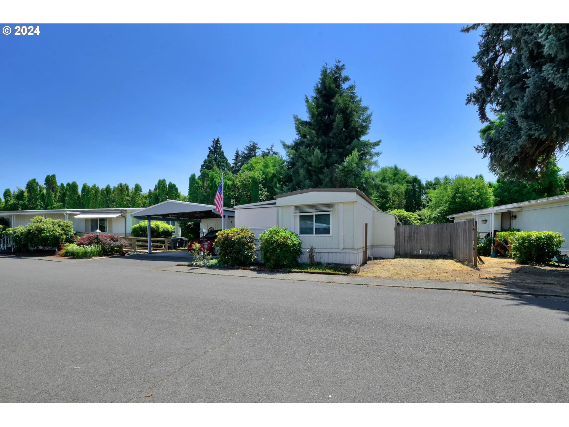 Centrally located in Filbert Grove Co-Op, Lane County's first Resident Owned Community. 55+ community with  recreation room. Open floor plan with pop out in living room and indoor utilities.   Many recent updates have been done including a new Goodman heat pump and furnace 2023, New carpet and vinyl 2022, Amana oven/range 2021, newer electrical service and new leaf guard filters. Nice covered carport and storage area. Covered front porch and backyard. This one is priced to sell.