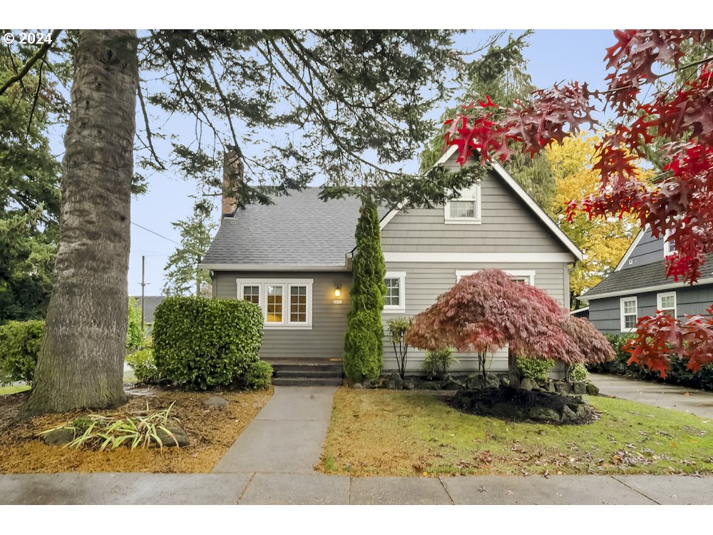 This one will steal your heart! Tucked away in the quiet, leafy NE neighborhood of Rose City Park, this English Tudor on a corner lot has beautiful structure and a smart floor plan that maximizes its generous square footage. When you step inside, you'll discover a light-drenched bonus room that's an ideal home office or study. Turn around and you'll discover the charm of its quintessential Tudor wood burning fireplace. Modern stainless steel appliances, gorgeous custom doug fir cabinets, and slab granite countertops create a gourmet kitchen. Plus, the versatile dining area lets you share a meal indoors or out on the lovely backyard deck. The layout of this home is outstanding, with bedrooms and a full bathroom on each of the three levels. On the main, a private bedroom with a full bathroom nearby. Upstairs, the large primary bedroom is a dream, with a walk-in closet and an impressive ensuite bathroom with marble slab counters. A charming bonus room with a closet rounds out the upper level for endless uses. In the basement, an expansive family room provides spacious opportunities, along with another wonderful bedroom, full bath, and laundry room. Renovated with a down-to-the-studs remodel in 2011, many updates have transformed this vintage home into a contemporary beauty, including modern plumbing, electrical, and a Terra Firma basement waterproofing system. Off the backyard deck, you'll find a whimsical paved patio area with a gas fire pit, lots of green space for planting and play, all fenced for privacy. Located in a fantastic neighborhood with an abundance of local perks - Trader Joe's, Whole Foods, Hollywood Farmers Market, Baerlic Brewing, cafes, food trucks, Hollywood Fitness, and the beloved Hollywood Theater. Many parks and schools nearby, plus great transit with buses and the MAX, and a Bikescore of 99! Open 11/15 Friday 3:30-5:30pm and 11/16 Saturday 12-2pm. [Home Energy Score = 6. HES Report at https://rpt.greenbuildingregistry.com/hes/OR10234034]