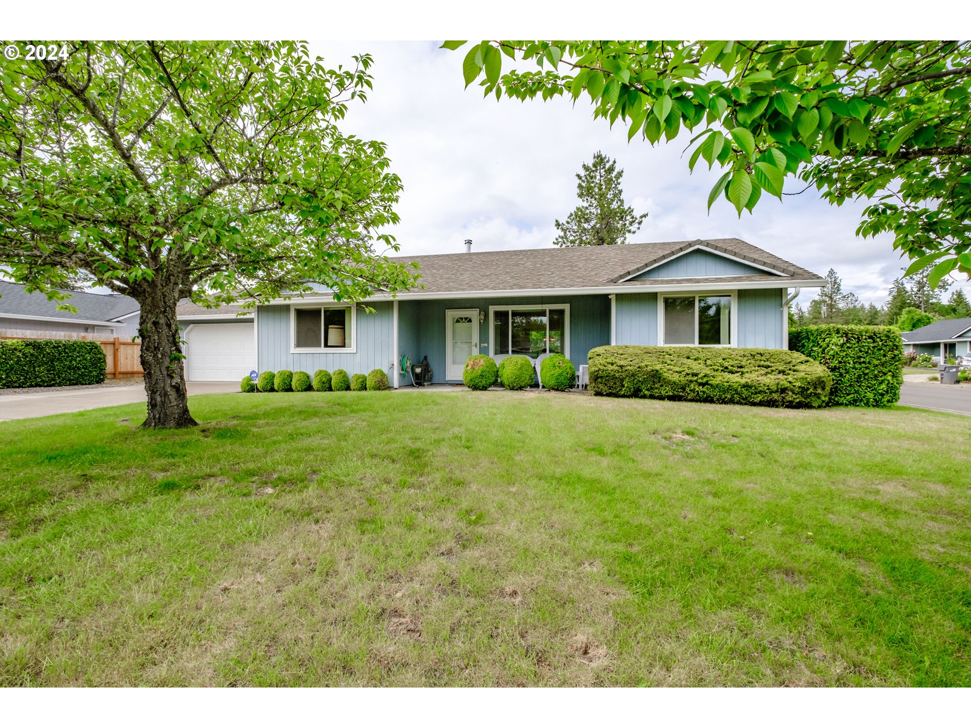 Lovely single level home with a nice open layout located in a peaceful neighborhood. Gorgeous front yard and landscaping. Large backyard ready to be turned into a wonderful garden. Certified wood stove in living room. Newer heat pump.
