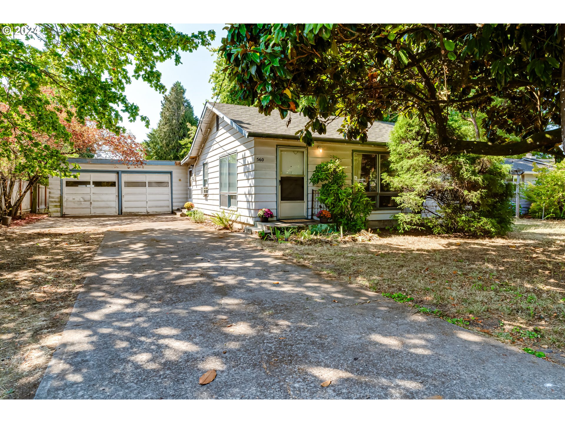 Welcome to a charming single-story home in the desirable River Road neighborhood! This vintage cutie has 2 bedrooms, 1 bathroom, and an attached 2-car garage. All the appliance in the large kitchen are included, plus the washer and dryer in the utility room. Situated on a generous .24-acre lot, where the spacious, level yard invites endless possibilities. Whether you dream of adding an ADU, planning for multigenerational living, growing a lush flower garden, or simply enjoying the open space, this property offers the freedom to invest in something truly special- subject to County approval, of course. Tucked away on a quiet, single-lane road, this home’s location gives a sense of calm and tranquility, providing privacy while still being close to the things that make life convenient and enjoyable. Minutes away from schools like Howard Elementary, Kelly Middle, and North Eugene High. Enjoy fitness and recreational activities at nearby Emerald Park. Easy access to Beltline Highway, Eugene Airport, and all the shopping and dining options on River Road, you’ll find everything you need. This isn’t just a house—it’s an opportunity to craft a space that’s uniquely yours, in a neighborhood that feels like home.