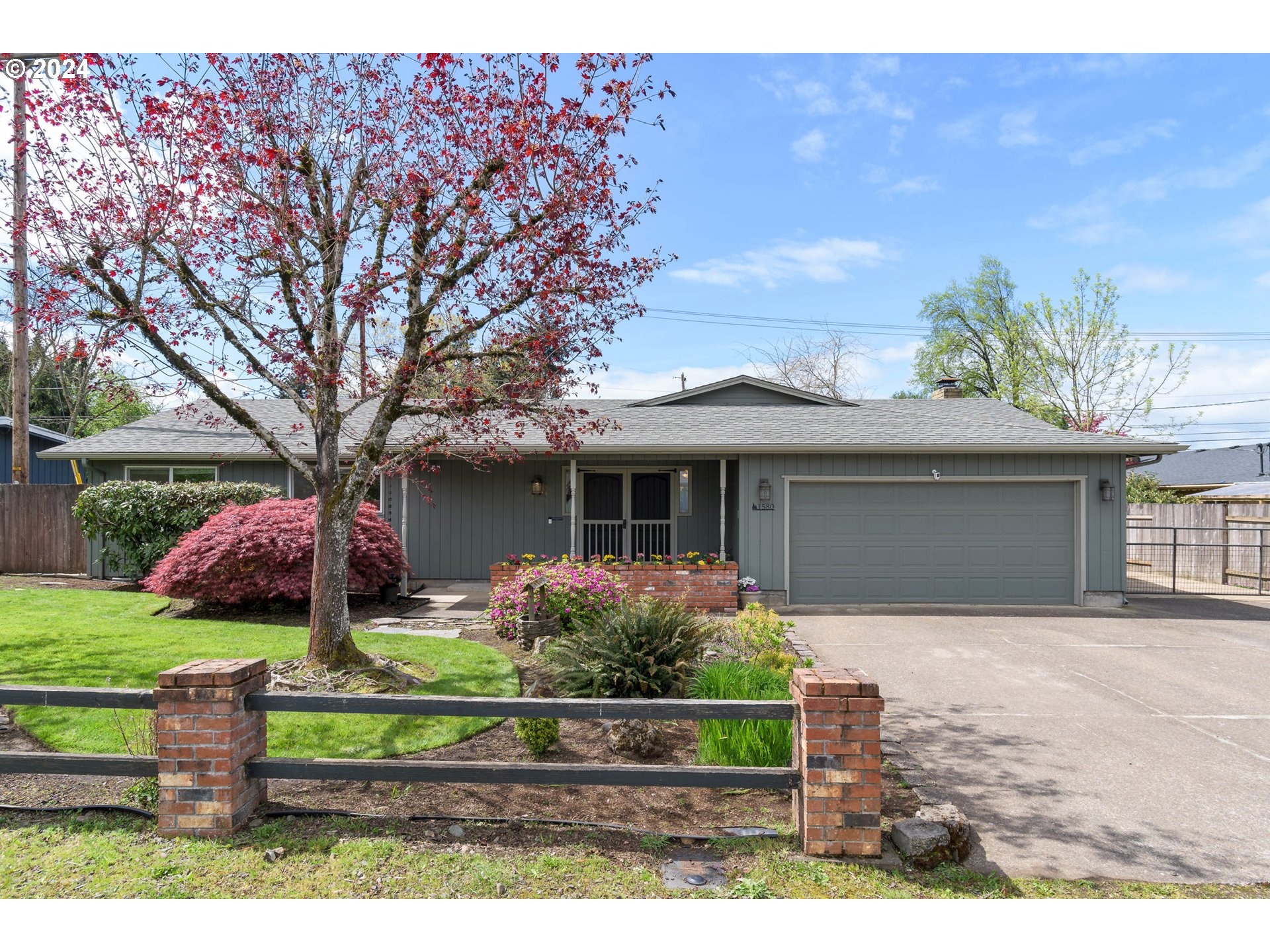 This charming 3-bedroom home with an office and 2.1 bathrooms is nestled on a large, peaceful lot in the heart of town, and is on a dead-end street with ample parking. A neatly manicured lawn and well-maintained landscaping welcome you, hinting at the care and attention to detail found throughout the property. Upon entering, you're greeted by a warm and inviting interior. The spacious rooms feature large windows that flood the space with natural light, highlighting the new LVP floors. A cozy fireplace adds to the ambiance, perfect for chilly evenings. The kitchen boasts SS appliances, lots of counter space, and a breakfast bar. Adjacent to the kitchen is the dining area, offering a lovely view of the backyard. The primary bedroom is a peaceful retreat, complete with an en-suite bathroom, storage, walk-in closet, and an office.  Two additional bedrooms provide comfort and privacy for family members or guests. Step outside to the expansive backyard, where a large custom-covered patio beckons for dining and entertaining. The lush lawn provides plenty of space for outdoor activities, gardening, and landscaping provides privacy.  Hot tub ready with electrical already in place. This home features a tool shed and wide RV parking, providing convenient storage for your recreational vehicles. Located in a quiet neighborhood, this home offers a serene escape while still being minutes from amenities and conveniences of town. With its blend of comfort, style, and functionality, this home is sure to capture your heart.