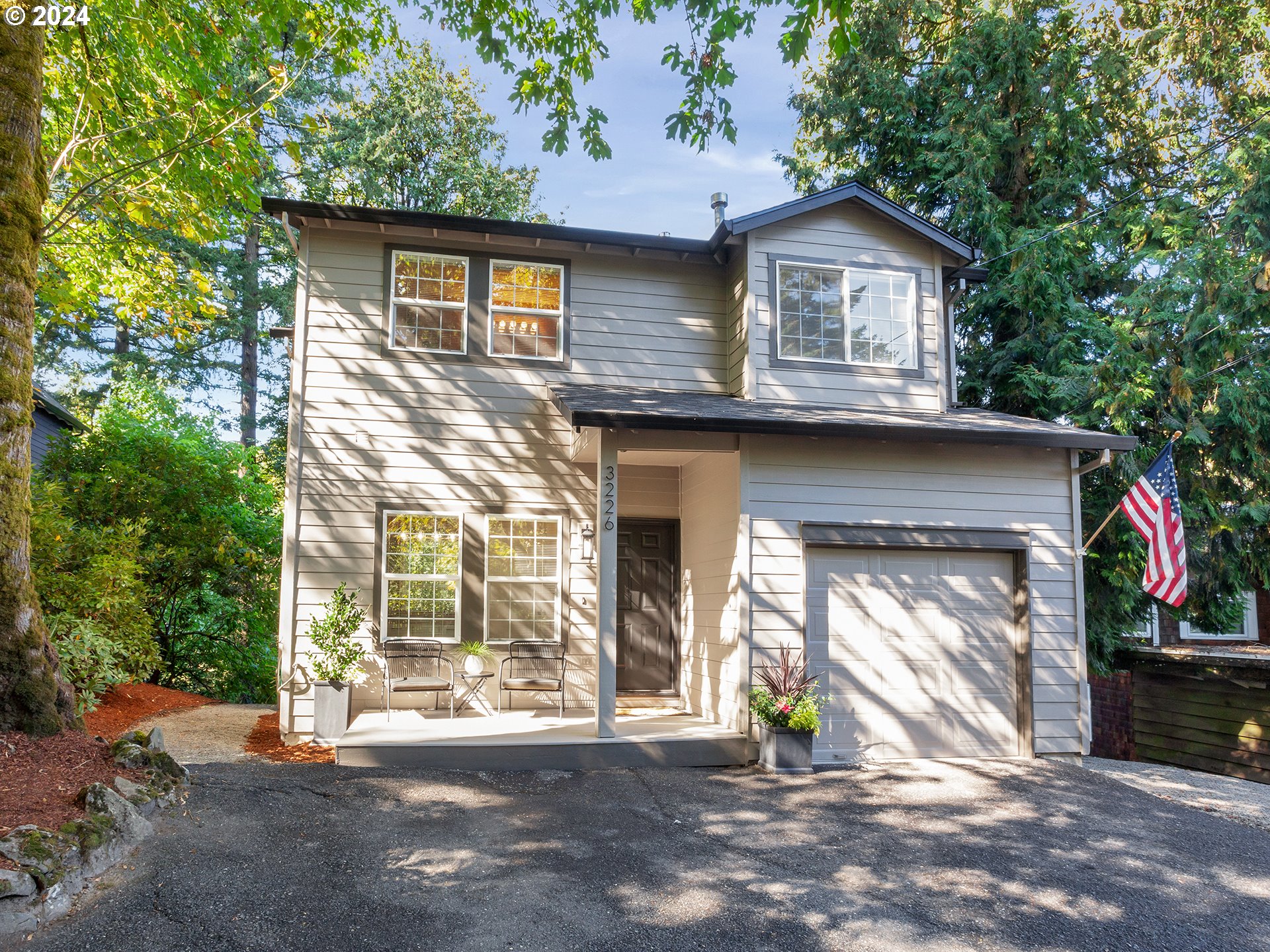 A rare opportunity to Live your Best Life in an area of more expensive homes, tucked away in this custom-built, move-in ready Sweetheart, backing your own .37 Ac treed Haven w/idyllic view of Enchanted Forest...in one of Portland's most desirable areas! Stylishly updated from top to bottom, this 3Bd/3.5Bth 2,432 Sq Ft Charmer w/2 kitchens & living areas, sports loads of flexible space, including open, airy rooms w/sweeping views of expansive, private treed backdrop; new exterior paint; newer Malarkey composition roof; new( never lived on) interior carpet throughout; newly refinished hardwood flrs+new flrs in Powder Bth & 2nd Kitchen; new fixtures & cabinet hardware; newer furnace & water heater; plus super flexible Lower Lvl w/2nd entry & outside areas! Main Lvl incl Kitchen w/gas cooking & eating bar, open to dining & generous Great Rm w/gas frplc, surrounded by walls of windows, opening to expansive deck (w/gas hookup for BBQ) in beautiful setting. Upstairs features a fantastic, 21'X15' Show Stopping Primary Suite w/wall of window & idyllic vista, soaring ceiling, 3 closets, incl 8'X6' walk-in, a set-apart vaulted Full Bth w/shower/tub/bench, generous vanity, storage & skylight! Across the hall, another Bdrm & Full Bth w/Lg vanity & tub/shower; attached upstairs Laundry w/cabinets. Lower Lvl offers rare additional flexible space/separate living area, featuring a generous Family Rm w/eating area open to 2nd Kitchen w/gas range/oven, cabinets, refrigerator, sink & counter space; additional Bdrm & Full Bath w/tub shower; 2 other storage closets & cozy finished bonus area for office/storage/utility/future Laundry Rm; keyed entry/exit to outdoor dining/relaxing/firepit areas; walkway to side entrance... perfect for teenagers, guests, tenants, home office!  Attached Garage w/opener & wkbnch & paved driveway w/3+ parking spaces!  All this AND the benefits of the Portland Heights area, minutes to Ptld, Bvtn, High Tech, Hospitals, great schools, Ptld Hts Park & More! [Home Energy Score = 5. HES Report at https://rpt.greenbuildingregistry.com/hes/OR10233326]