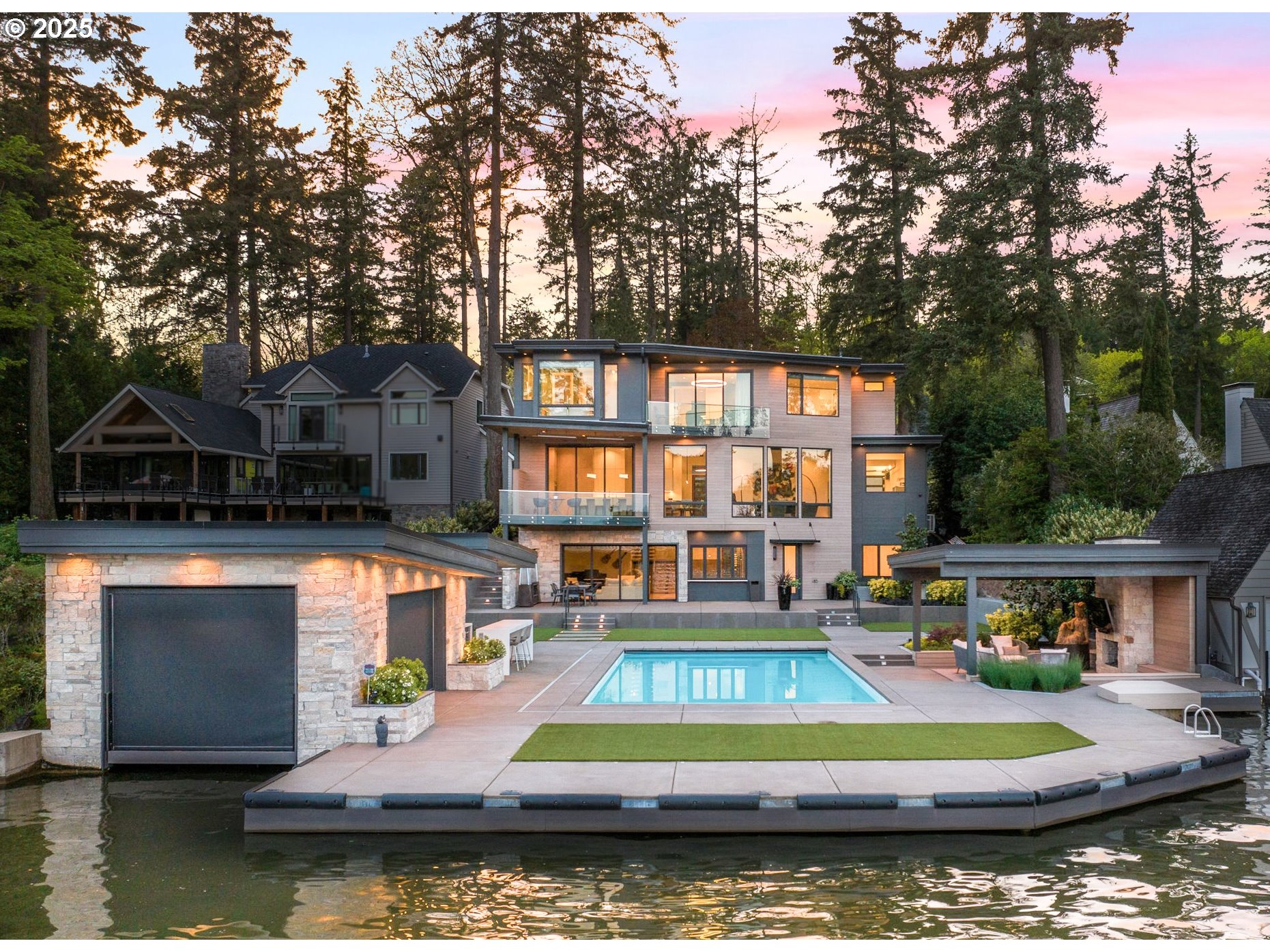 4357 SOUTHSHORE BLVD Lake Oswego, Oregon Luxuriate in the pristine Oswego Lake lifestyle with an award-winning builder's impeccable eye for contemporary comfort, miles of sparkling water vistas, and superb entertaining in this perfectly positioned modern masterpiece estate. The gated, private driveway opens to a private lake level parcel with destination 30x20' pool plus spa, outdoor kitchen, fireplace, outdoor shower, heated patio, dock, and boathouse with lift and custom rising floor. The dazzling interiors feature floating staircase, a 3-stop elevator, leathered quartzite counters, plank flooring, walls of lake view windows, full bar and glass-walled wine room, and a vast party room with wall of slide-away doors opening to lake side entertaining. Jaw-dropping at every turn, yet elegantly understated, this destination Oregon luxury oasis leaves no desire unmet! Showcase great room kitchen featuring hidden pantry and veranda, primary suite with lake view soaking tub, dressing room, and private balcony, fitness studio with Finlandia sauna, and collector's 3 car epoxy garage. Equally at home as your personal haven away from it all or as an unforgettable celebration space, Oswego Lake's leading new contemporary offering reinvents Oregon world-class waterfront living!