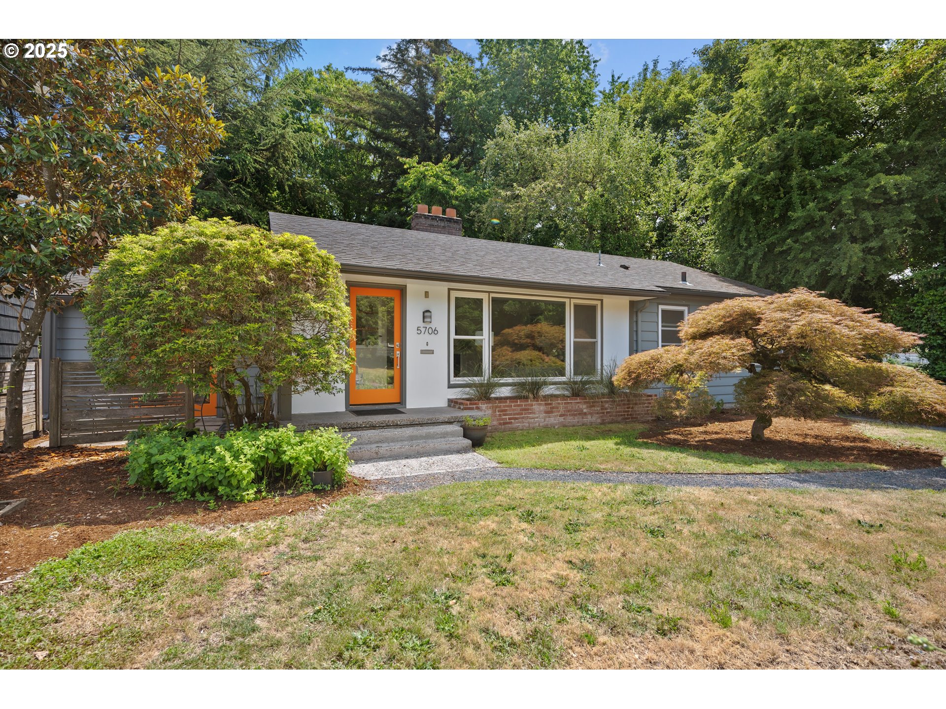Mid-century charm, modern updates, and a park-side setting come together in this uniquely cool South Tabor home. Located on a quiet dead-end street and backing directly to Clinton City Park, the 0.18-acre lot offers rare privacy and green space in the heart of SE Portland. Inside, original hardwoods run throughout the main level, grounding the home’s character while thoughtful updates elevate everyday living. The renovated kitchen (2022) features quartz counters, custom cabinetry, a 34” farmhouse sink, touchless faucet, stainless 750 CFM range hood, and hybrid LVP flooring that extends into the dining area. A large formal dining room connects effortlessly to the backyard through a sliding door, creating great indoor-outdoor flow. The layout offers flexibility with a garage conversion that adds a creative bonus space—ideal for a studio, home office, or lounge—complete with radiant floor heat, French doors, updated electrical, and access to a private courtyard. Downstairs, the finished basement includes a legal bedroom, family room with cozy fireplace, full bath, egress windows, and new LVP flooring (2023), making it great for guests, hobbies, or quiet retreat. Major system upgrades include a new roof (2016), new gutters (2023), dual on-demand water heaters, 95% efficient variable-speed furnace, 200-amp electrical panel, and updated sewer and gas lines. Outside, unwind in the 7-person Rhythm hot tub (2021) or enjoy the fully fenced yard, mature landscaping, and Tuff Shed for extra storage. With fresh interior and exterior paint, updated windows and doors, custom-fitted screens, and extensive renovations completed since 2008, this home is full of personality, function, and style in one of SE Portland’s sweetest tucked-away locations. A rare blend of space, flow, and setting—don’t miss your chance to experience it. [Home Energy Score = 3. HES Report at https://rpt.greenbuildingregistry.com/hes/OR10239419]