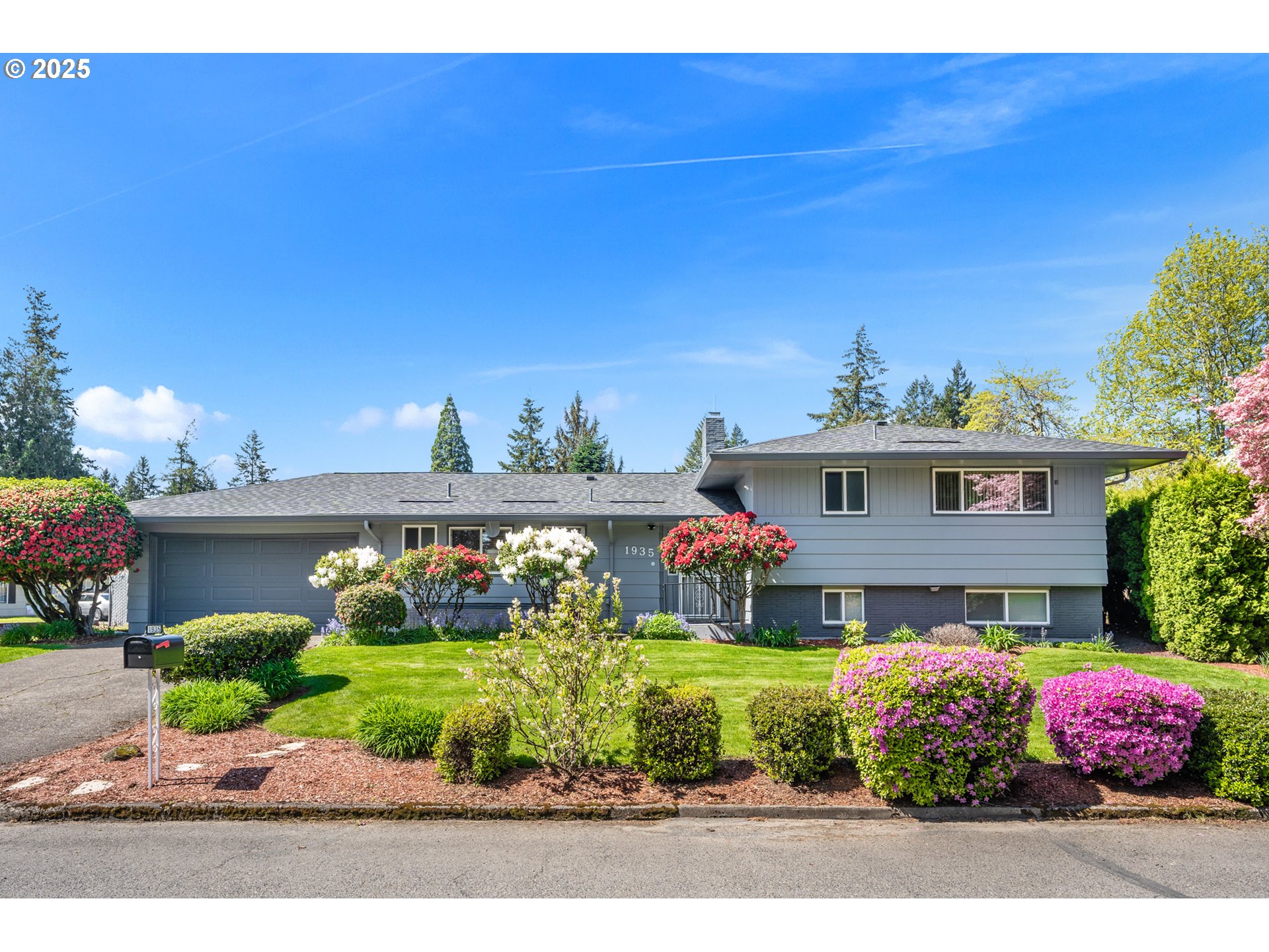 Welcome to this meticulously maintained Tri Level home, loved by the same owner for many years. Situated on an oversized corner lot with amazing curb appeal and beautiful, mature landscaping. Warm and inviting living/dining room combo with plenty of natural light coming from the bank of windows across the back of the house. Updated kitchen with eating bar, newer appliances and access to the half bathroom. Refinished hardwood floorings throughout the main and upper levels. Finished basement with family room, newer carpet and featuring a 2nd fireplace and exterior entrance, bonus room with closet, could be used as a 4th bedroom and combo laundry/full 2nd bathroom. Private, fully fenced backyard with room for everything. Gorgeous patio for entertaining, large lawn, tuff shed, dog run and extra parking pad that could be used to store a trailer, boat or small RV. Upgraded systems include: new Rheem furnace in 2025, new roof in 2024, new exterior paint and gutters in 2024, new garage door in 2024 and new hot water heater in 2023. Move in ready! [Home Energy Score = 2. HES Report at https://rpt.greenbuildingregistry.com/hes/OR10238465]