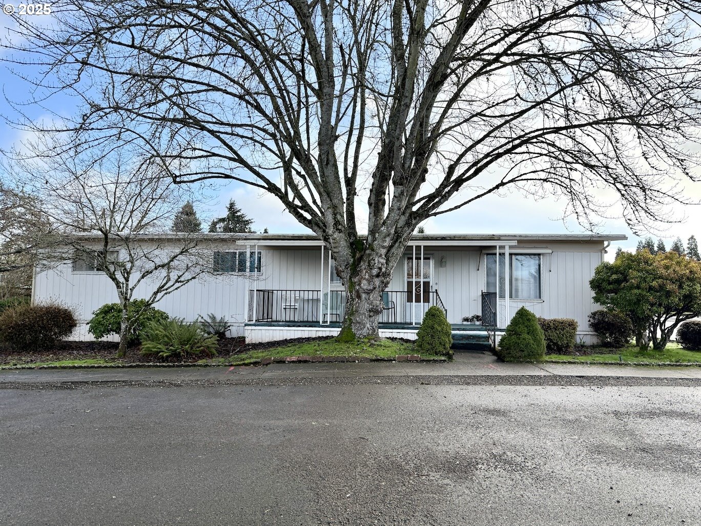New membrane roof in 2024, fridge new in 2023. Lovely LVP floors, covered front and back porches lead to yards. Suite bedroom has large walk-in closet and attached full bathroom. Parking for 2 cars in carport, which also has a storage shed. A 2nd storage shed, located in back yard, made of natural wood. 55+ manufactured home co-op community. $856/monthly space rent: this includes water, sewer, garbage, basic land cable, use of pool tables, club house, library, and dog park. Park management approval required to reside in this Park. Monthly income to be 3x's or higher than the space rent. Very close to Riverbend Hospital, shopping, restaurants, Gateway Mall, gas stations, and grocery. Caregiver's under 55 yrs old  allowed to reside with resident with accepted applications. Pets allowed.