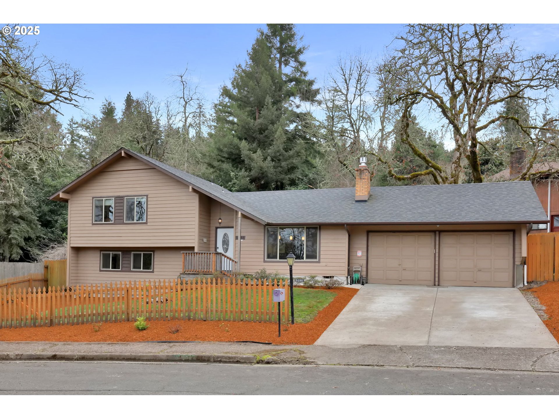 Situated in the heart of South Eugene, this well-maintained split-level home offers 4 bedrooms, 3 baths, and a spacious open floor plan perfect for comfortable living. Fresh interior paint brightens every room. The updated kitchen is a chef’s dream, boasting stainless steel appliances, granite countertops, all-wood cabinetry, and a central island. The inviting living room features a cozy gas fireplace insert, ideal for chilly evenings.The upper level includes a primary suite with double sinks and a tiled shower, along with two additional bedrooms and a second bathroom.Downstairs, the expansive family room provides plenty of space for entertaining or relaxing, complete with a large closet and additional storage. The lower level also features a fourth bedroom, a third full bath, and a convenient indoor laundry room with a sink and direct access to the outdoors.Step outside to a fully fenced backyard designed for year-round enjoyment, featuring a covered patio perfect for entertaining. The space is also 220-wired for a hot tub connection. Out front, raised garden beds offer the perfect opportunity for gardening enthusiasts to grow flowers, herbs, or vegetables.Whether you're hosting gatherings or unwinding in your private outdoor retreat, this home offers the best of South Eugene living. Don’t miss out—schedule your showing today!