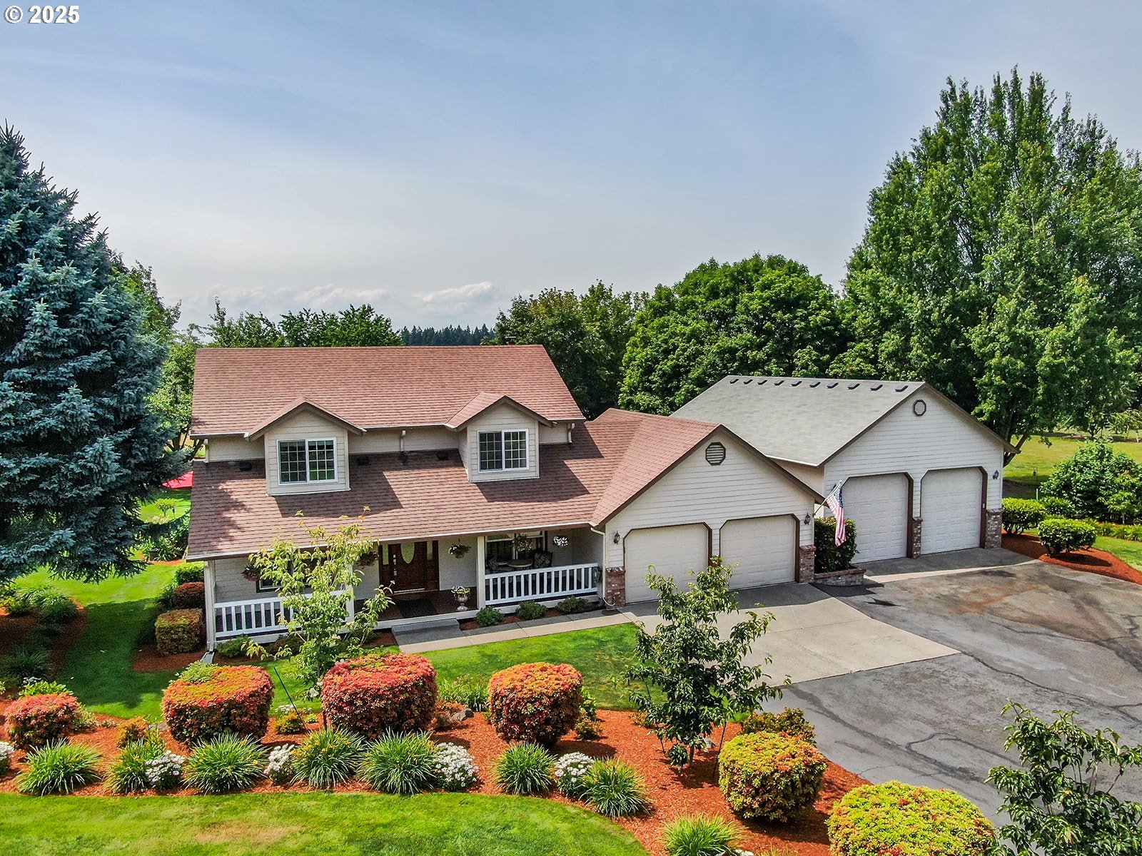 OPEN HOUSE Saturday June 28 and Sunday June 29, 11AM-1PM both days.  So many updates and features with this amazing property!  2082 sq ft with 4 BR/2.5 BA. Newer wood floors downstairs, updated kitchen with stainless appliances, new plumbing fixtures, new Milgard windows, covered front porch, 12X40 almost completely covered deck with ceiling fans, bar, speakers and a 7X7 six-person hot tub.  26X40 detached shop with 10X10 roll up doors with openers, 110w and 220w electrical, LED lighting, 10X26 storage loft, Milgard windows.  1 beautifully landscaped acre with raised garden beds, in-ground sprinkler system, solar lighting, fruit trees/shrubs, 8X10 garden shed.  See features sheet for more and do not miss seeing this one in person!