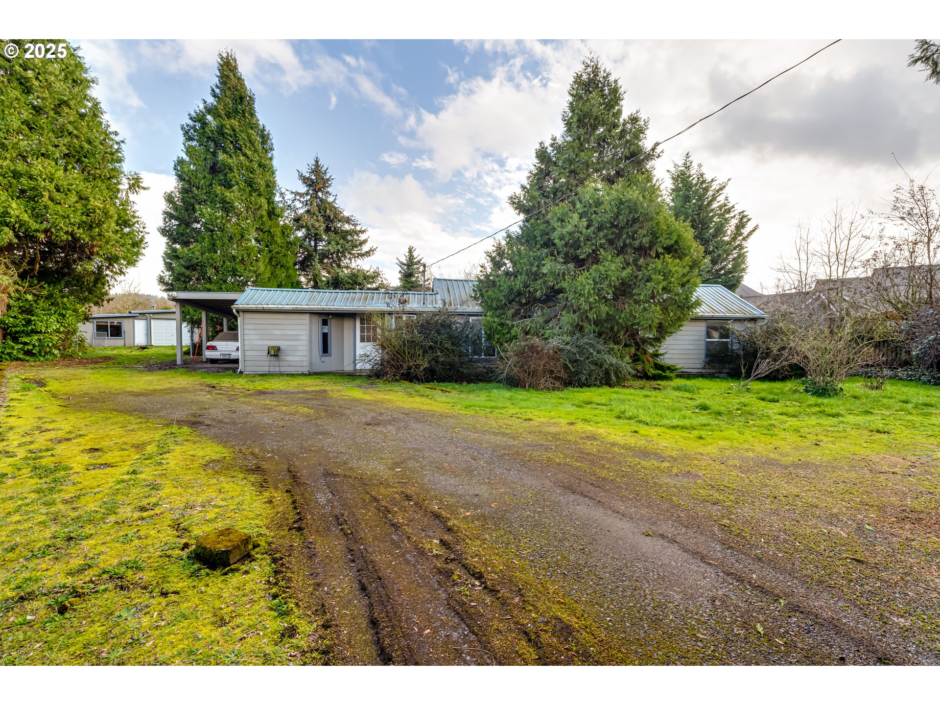The presence of mold has been detected in this residence and has NOT been remediated. Spacious 0.6-acre lot offers the perfect canvas to create the home you've always wanted, with plenty of room left for outdoor activities, a garden, or additional structures. The property includes two existing buildings (not currently livable), providing opportunities for future renovation or removal to suit your vision.Conveniently, a sewer line runs along the back fence, ready for future connection. Already attached to public water. This property is ideal for crafting your custom home and more.Buyer to do all due diligence.