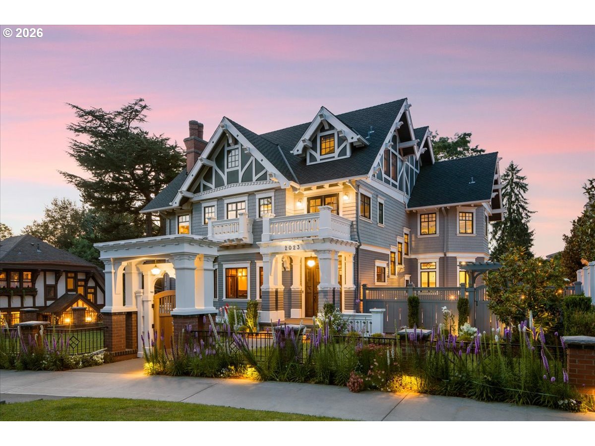 A Masterwork Reimagined in Portland Heights. In the coveted grid of Portland Heights, where tree-lined streets meet timeless architecture, stands a residence that defies convention—a Foursquare Craftsman reborn with uncommon vision and uncompromising craft. This is not mere renovation. In 2017, historic home designer Aram Irwin and luxury builder Randy Chandler undertook a comprehensive reimagining—honoring every authentic detail while engineering a home for the way we live now. Four curated levels unfold with the rhythm of discovery. Sunlight catches hand-selected stained glass. Rich chocolate oak glows against light cream walls. Arts and Crafts details emerge at every turn—not as museum pieces, but as living elements of a home that breathes. At the heart of it all: a kitchen that stops you mid-sentence. The room guests drift toward, the room that makes everyday cooking feel like occasion.Gracious living and dining spaces flow without boundary. Ascend to the top floor and find a soaring retreat where holidays unfold by the fireplace, games stretch into evenings, and everyone has room to breathe—a space designed for the full texture of life well lived. Retreat to a private theater engineered for immersion. Unwind in the Old English–style bar or the warmth of a private sauna. Six bedrooms. Five full baths. Two powder rooms. A private ADU guest suite. Every modern amenity, executed with precision. Nothing wished for; nothing compromised. A striking gated entry announces arrival. An English garden offers quiet refuge. Designer finishes elevate every sightline. The private rear patio and gated flat yard extend living into the open air. Portland’s architectural heritage, thoughtfully preserved and boldly reimagined. [Home Energy Score = 4. HES Report at https://rpt.greenbuildingregistry.com/hes/OR10007749]