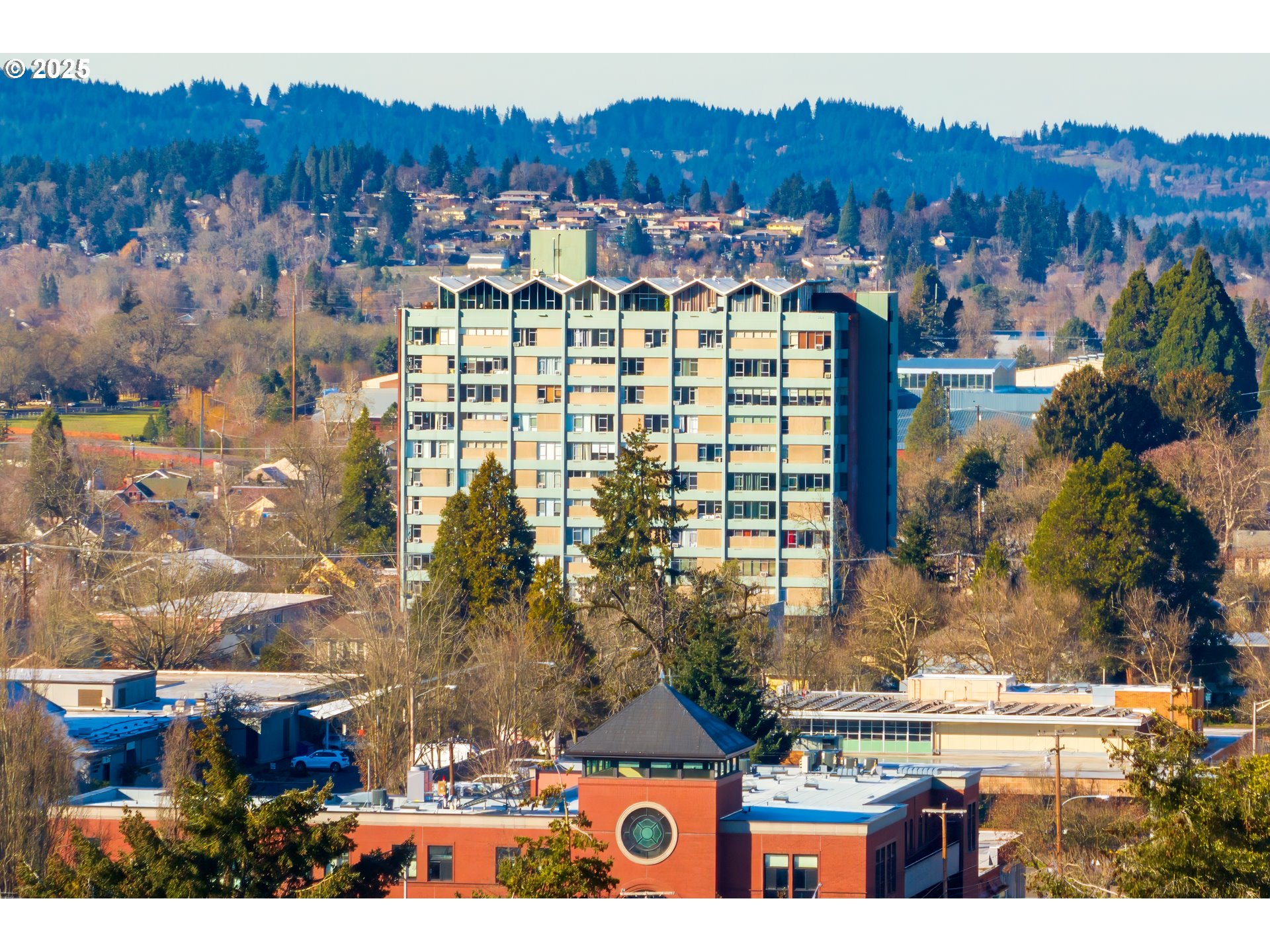 This 6th-floor studio condo offers impressive eastern city views and is situated in a secure, well-maintained building. Onsite amenities include deeded, gated parking spot, onsite laundry and storage.  Convenient central location close to shopping, transportation, eateries and Library as well as within easy reach of the University of Oregon campus. Ideal for anyone looking for a comfortable, low-maintenance living space with a prime downtown location. Some pets allowed.