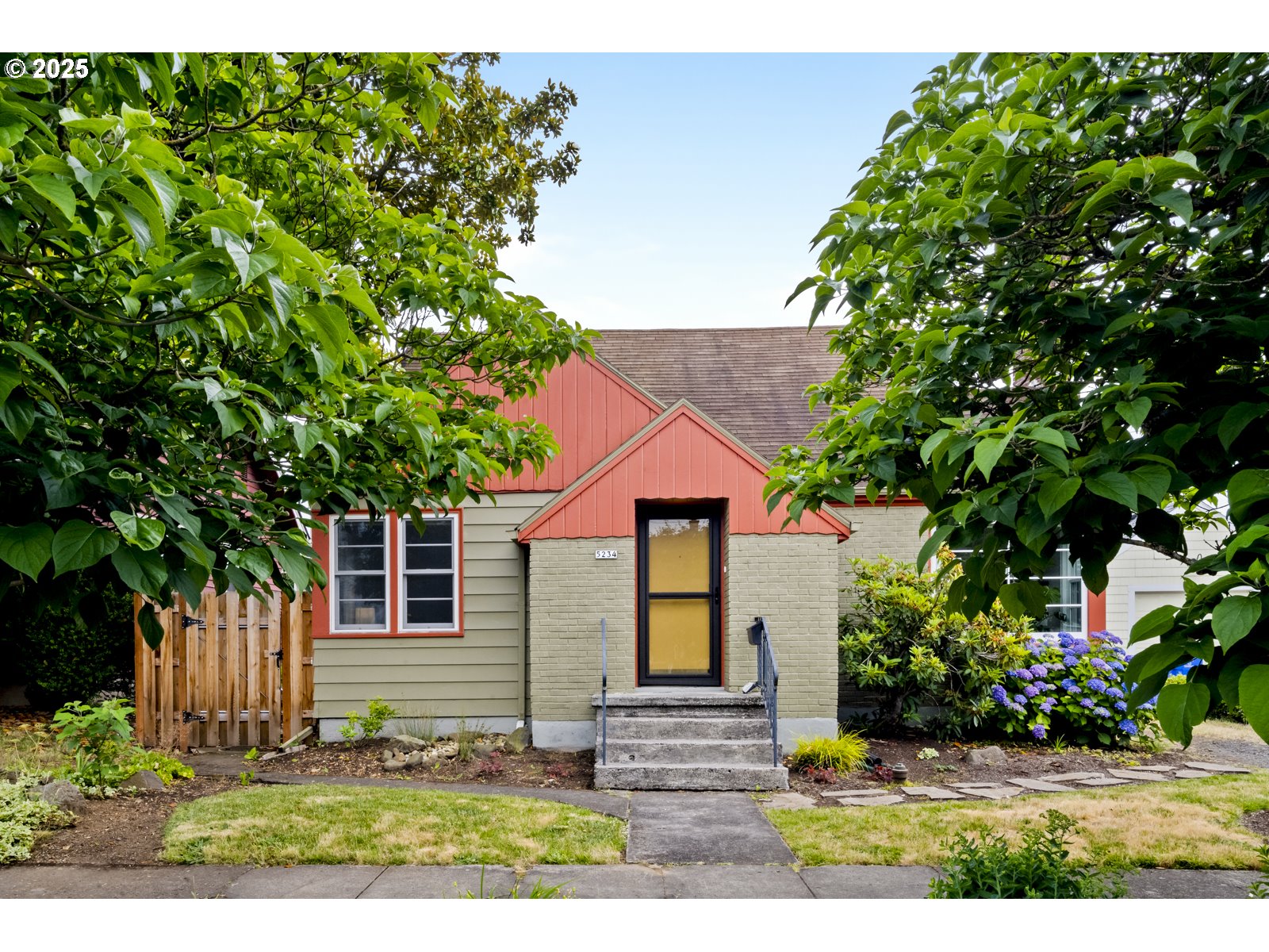 Vintage charm combines with quality updates and ideal layout in this oh-so-charming Rose City Park home. Generous entry opens to bright living room with crown molding, fireplace and big picture window. Huge kitchen has updated appliances (uber quiet Bosch dishwasher!), space for a breakfast table and a pantry. Upstairs, two more bright bedrooms make room for everyone! Downstairs, the finished basement is kitted out as separate guest quarters with separate full bathroom, wet bar, gas fireplace & egress window. Easy ADU potential! So much storage throughout including big hall closets upstairs and main and full storage room (separate from utility room) downstairs. Just off the kitchen is a spacious covered patio opening to the backyard, with raised bed and occasional bunny sighting. Big garage off alley makes ideal shop/studio space. Oversized driveway affords options for camper/RV/etc off street.Quality updates include central AC and 200 amp electrical panel/service, smart thermostat, new Marvin wood-frame windows, and new tub/toilet/tile in main floor bath.   Washer, dryer, kitchen appliances, and custom window shades (top down/bottom up with blackout in downstairs bedrooms) throughout convey with the sale. Dreamy location on quiet street with proximity to the best of Portland's offerings. Less than 2 blocks to Normandale park (pups will love fantastic fenced off-leash area), less than a mile to Trader Joe's & Whole Foods, Hollywood Max stop, I-84 Providence, the Hollywood Theater and so much more. Laurelhurst/Grant school assignments round out the package. Open house Saturday, 6/28, 12-2p. [Home Energy Score = 1. HES Report at https://rpt.greenbuildingregistry.com/hes/OR10124008]