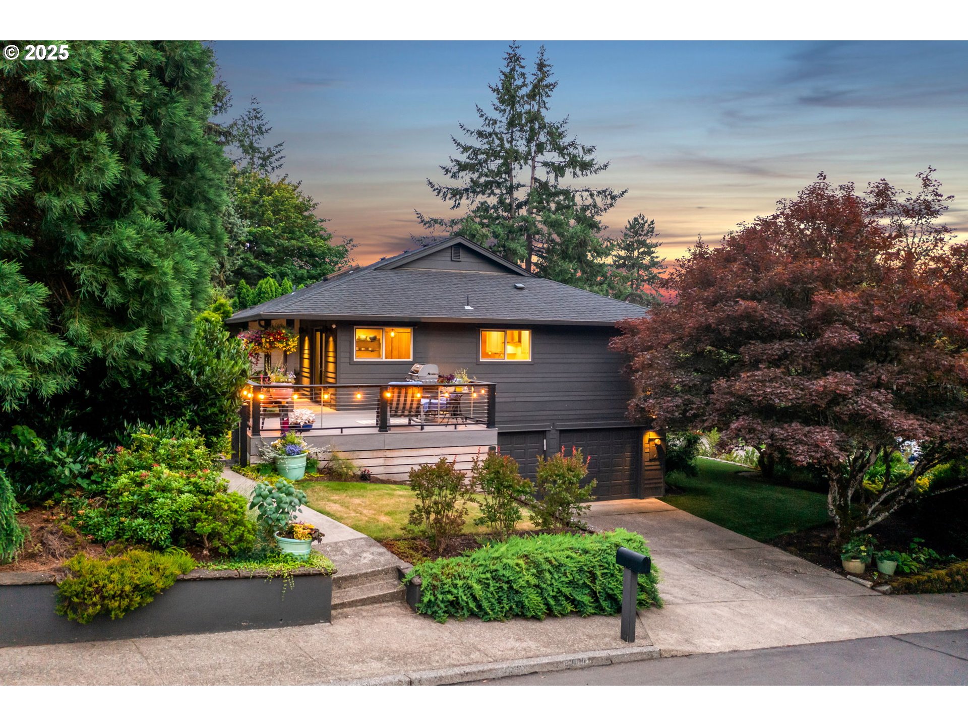 Located in the heart of the Palisades neighborhood, this fully updated home offers access to the Greentree Pool and top-rated Lake Oswego schools—making it an ideal blend of lifestyle and location. Inside, you'll find luxury finishes throughout, including a main-level primary suite for easy living. The spacious living room is anchored by a stylish woodburning fireplace with a modern custom surround, creating a cozy yet sophisticated focal point. The designer kitchen is built to impress with a large center island with bar seating, quartz countertops, custom cabinetry, stainless steel appliances, and elegant pendant lighting. Enjoy the beautifully lit front deck, perfect for outdoor dining or relaxing evenings, all set in a lush, established neighborhood. This move-in-ready home offers modern comfort in one of Lake Oswego’s most desirable communities.