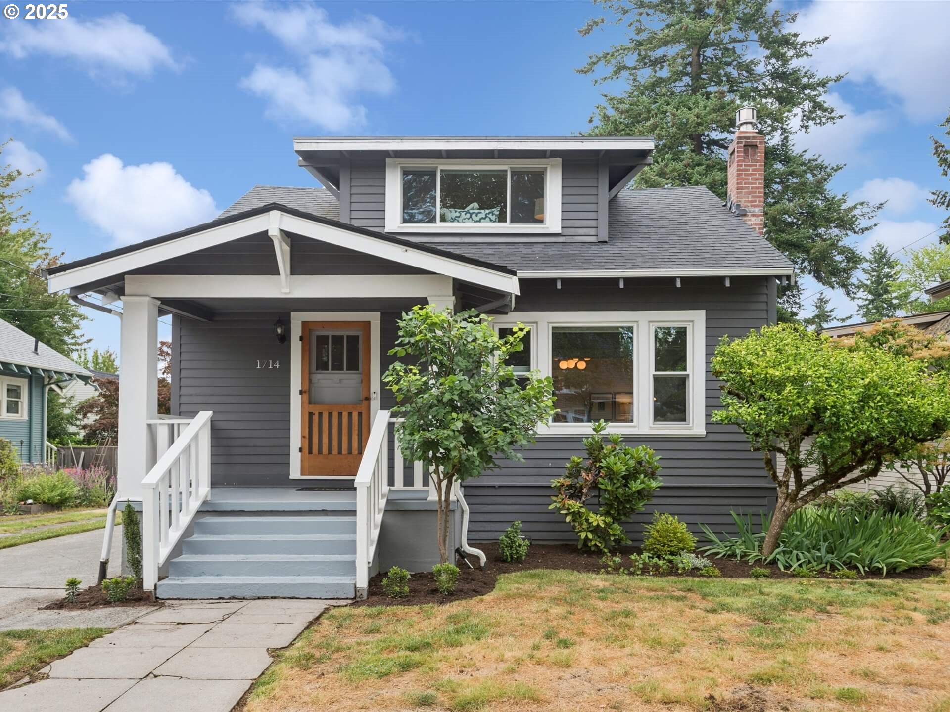 Restored Rose City Craftsman with all the right vibes. Classic front porch? Check. Original built-ins and hardwoods? Yep. New gas fireplace and remodeled kitchen with quartz counters, oversized island, gas cooking, and sleek stainless appliances? You got it. Two main-level bedrooms with fir floors, plus a dreamy upstairs suite with bonus play/lounge space. Updated baths feature bold, modern fixtures. The lower level offers serious flexibility—complete guest quarters with its own kitchen, living room, bedroom, and office. Major system upgrades: roof (2019), thermal windows (2020), high-efficiency furnace (2023), central AC (2019), and newer electrical. Dialed in and ready to roll, all in one of Portland’s favorite neighborhoods. [Home Energy Score = 3. HES Report at https://rpt.greenbuildingregistry.com/hes/OR10033301]