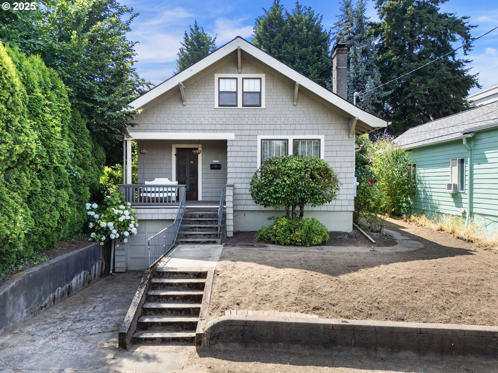 Welcome to this charming Portland Craftsman bungalow in sought-after Brooklyn, where classic character meets everyday comfort. Relax on the inviting covered front porch, complete with a porch swing, before stepping inside to discover beautiful wood floors, elegant tile bathrooms, and a formal living and dining room with 9-foot ceilings and crown molding. The living room features a cozy fireplace flanked by built-in glass-front cabinets, and original wood doors with vintage hardware add timeless appeal throughout. The private, fenced backyard offers a peaceful retreat, and the fully finished basement may offer potential for an ADU. [Home Energy Score = 1. HES Report at https://rpt.greenbuildingregistry.com/hes/OR10191433]
