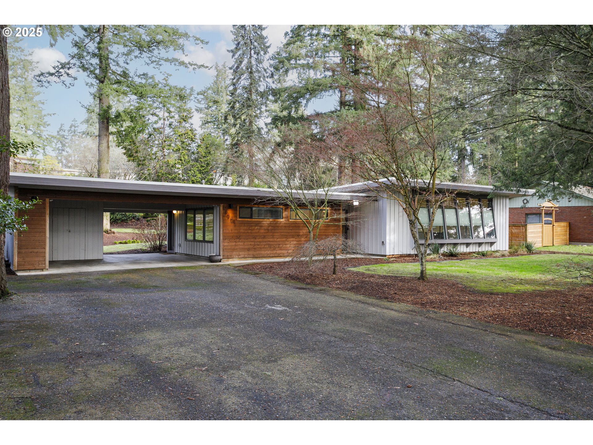 This home is an exquisite example of Mid Century Design at its very finest . The homes setting is a peaceful, private 3/4 acre lot with trees that creates a feeling of being in a park. From the moment you drive up to this home you fall in love with its beautiful style and the setting. Then you walk into the entry, you fall more and more in love with this home with each step into the open living / dining room, the ceiling to floor unique design of slanted out windows allow the sunlight to flood into the living room, the fireplace greets you at entry and continues across the entire room with a sitting shelf and it large opening for wood burning. The home has been tastefully updated with open concept kitchen with new cabinetry, quarts counter tops and tiled back splash, and open wood shelves. The two beautifully updated baths offer tiled shower, tub and floors with unique cabinetry. Unique polished heated concrete floors throughout the main living space and primary oversized bedroom allow this home to always feel very comfortable as that is how the home is heated. There are 3 bedrooms and it is possible to use one of the very oversized bedrooms as an additional family room or office with entertaining space if you would like. This home has a very special appointment to space and design, come see for yourself, I dare you not to fall in love with this home from the minute you walk in. The Columbia Ridge / Vancouver Heights neighborhood is highly sot after for its unique large lots and location, and being quietly tucked away, located just off Lieser Rd and Camas 14 Hwy. Located just 15 minutes to airport, and downtown water front in Vancouver with restaurants, shops, hotels and walking paths. If you love Mid Century Atomic Ranch design, you have found the home you have only been only able to dream about until now. This home will go quickly, as it is a one of a kind home, make it your next home. Donâ€™t forget to watch the walk through video, it shows you how the home lives.