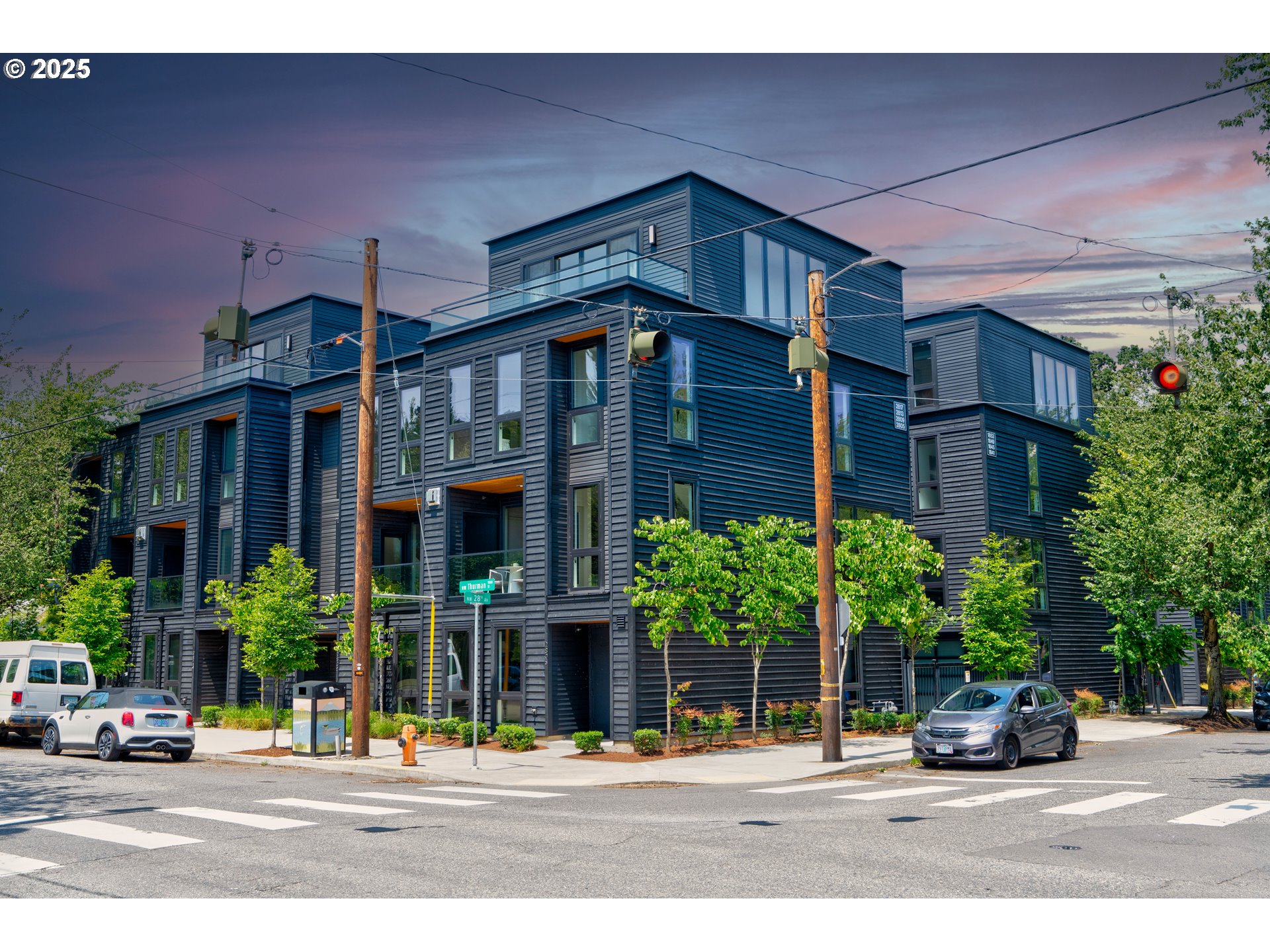 Modern luxury meets unbeatable location in this stunning 4-story corner unit at 28th & Thurman—arguably the best in the complex with sweeping views of the downtown skyline. Enjoy open-concept living with engineered hardwood floors throughout the main level, a gourmet kitchen featuring top-of-the-line stainless steel appliances, a large quartz island, and plenty of space to entertain. This thoughtfully designed home includes 3 carpeted bedrooms, a cozy reading nook, dedicated office, and laundry room. Live close to everything in style and comfort!