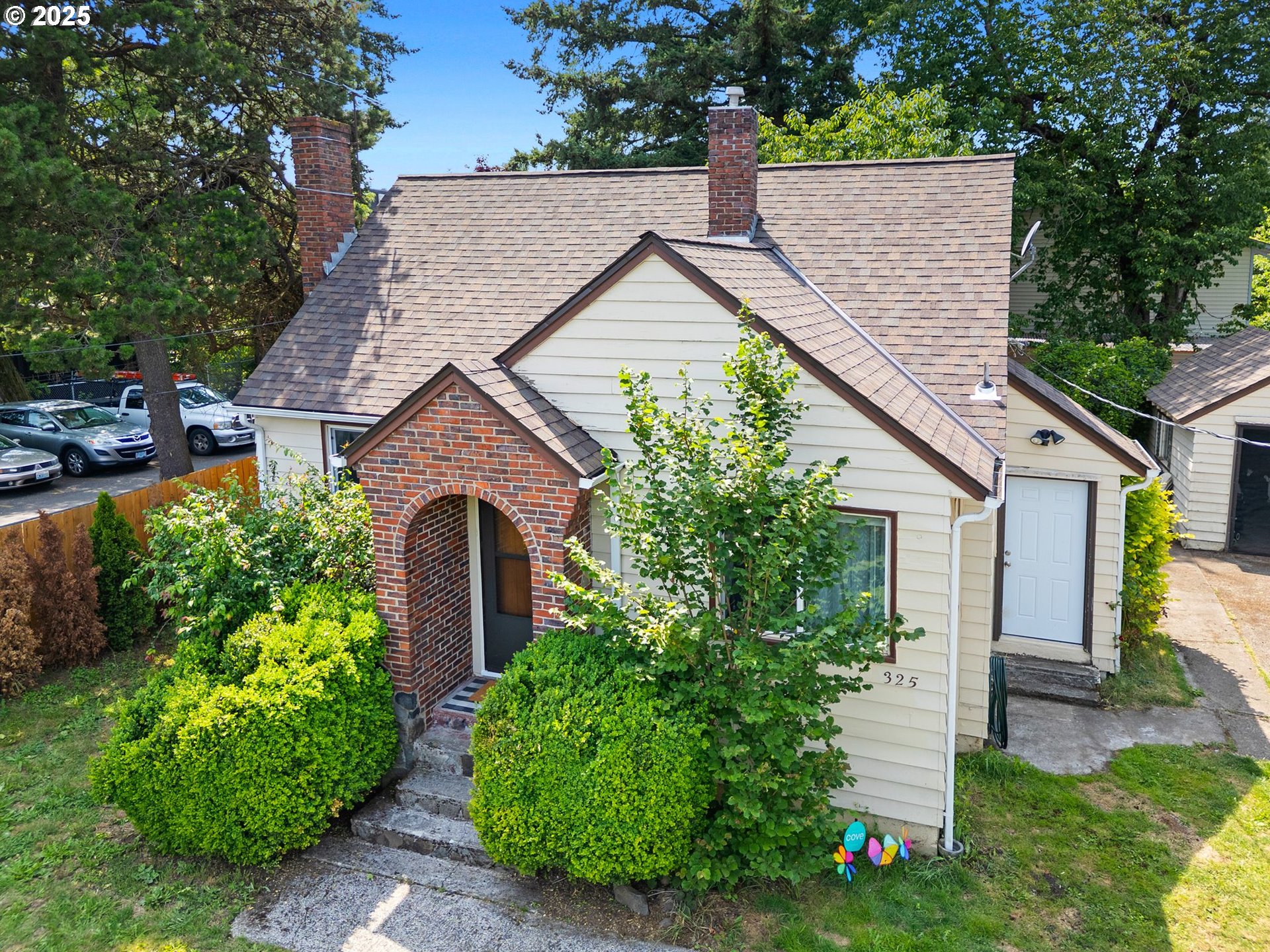 Welcome to this beautiful English Cottage, perfectly located near shopping, dining, and public transportation. Step into a warm and inviting living room with original hardwood floors and a classic fireplace full of charm and character.The main level features two bedrooms and an updated bath, while the spacious primary suite upstairs offers a private retreat. The remodeled kitchen is a highlight with granite countertops, updated cabinetry, and a sunny eating nook—ideal for morning coffee.The partially finished lower level offers flexible space with a fourth bedroom, a large family room, utility/laundry area, and a dedicated furnace/storage room—great for guests, hobbies, or even a potential separate living space.Outside, the oversized, fully fenced lot is a true standout. Whether you’re dreaming of a garden, play area, ADU, or just room to roam, the potential here is huge. There’s also a gated entrance and a detached 1-car carport for added convenience.With a gas furnace, updated windows, and a layout that offers both character and functionality, this home is the perfect mix of comfort, style, and opportunity. Don’t miss it!