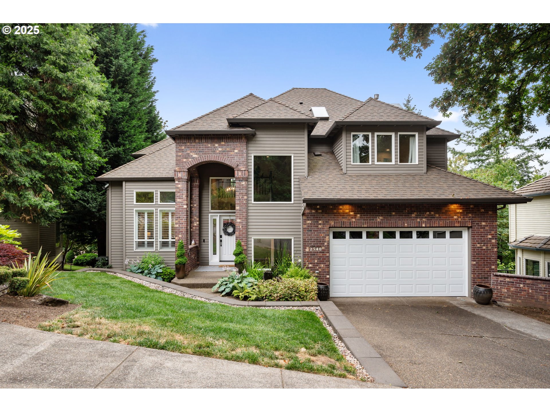 Gorgeous & well maintained West Linn home on a 1/4 acre lot! Walk in to high ceilings, hardwood floors and an abundance of natural light. Beautiful granite counters & gas appliances in the kitchen. The kitchen flows into the breakfast nook & living room which is surrounded by an oversized deck overlooking your 0.25 acres at the top of Kilkenny. Upstairs you will find a beautiful owner's suite with a jetted tub, 2 additional bedrooms, laundry & a full bath. In the basement you will find a custom built library (yay!), bedroom #4, full bath, bonus room and a oversized storage area for all the camping gear & holiday decor. The basement bonus room leads you right out to covered second deck- steps off the deck bring you to your terraced backyard with an amazing outdoor living area complete with a gazebo with electrical, firepit & comfy furniture (all included!). Backyard is fully fenced for your furry friends. Located in one of Oregon's top school districts- this is the home you have been looking for.