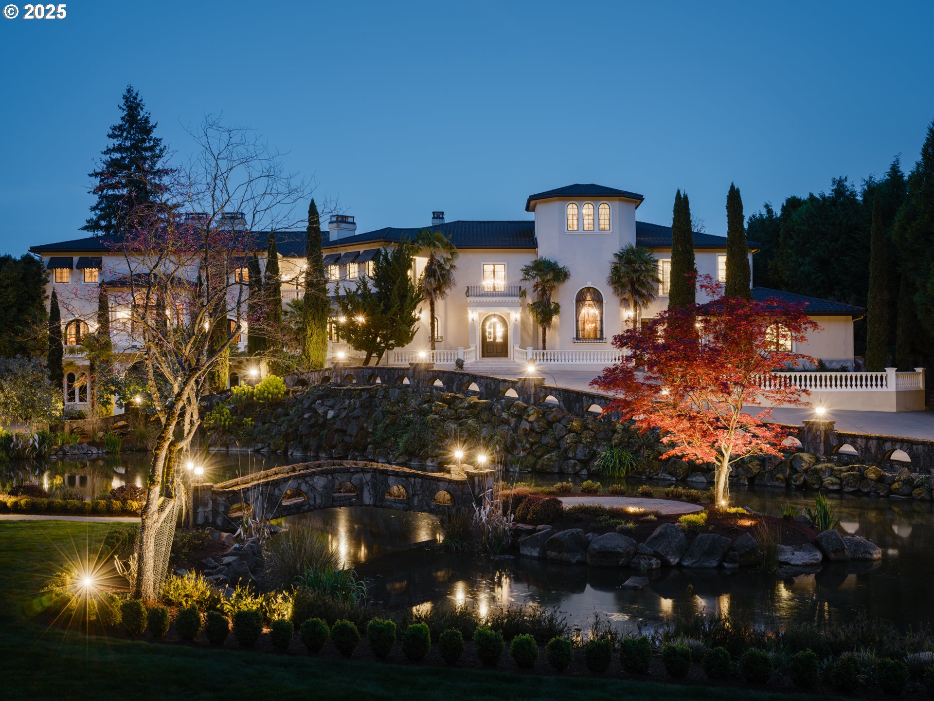 12850 FIELDING RD Lake Oswego, Oregon This exquisite estate will leave you speechless the moment you pass through the gates. Your very own pond greets you as you drive up the circular driveway. Step inside and prepare to be in awe of the custom finishes, jaw-dropping craftsmanship, and dramatic architectural and design details throughout. At the heart of the home, a stunning theater room boasts soaring ceilings, a grand fireplace, Juliet balconies, and a built-in stage that can transform into an elegant ballroom. Through the double doors, you'll find a home gym and a spacious billiards room, complete with a full bar and kitchen—perfect for entertaining. A dream for any reader, the home features an elegant library along with several beautifully designed home offices throughout. Striking hardwood floors lead you into a kitchen that’s a true culinary delight, with coffered ceilings, custom cabinetry, and top-of-the-line gas appliances. Hide away and play in the forest-themed playroom, complete with a treehouse bunk and a rope bridge. Upstairs, the primary suite offers a spa-like retreat with custom tile work, a large walk-in closet, double vanities, an oversized soaking tub, and a walk-in shower. With over eight additional bedrooms and eleven full bathrooms—each with its own unique charm—there’s room for everyone to relax in comfort and style. Step outside to enjoy resort-style living on your palatial patio, featuring seating for 20, a courtyard fountain, a fully equipped pool house, an expansive pool, an in-ground spa, and multiple entertaining areas—all with serene views of the Willamette River. Stroll down to your private dock and immerse yourself in everything the river has to offer. The property also includes 12+ garage spaces and a massive workshop located beneath the home. Don’t miss this rare opportunity to own one of Oregon’s most breathtaking riverfront estates.