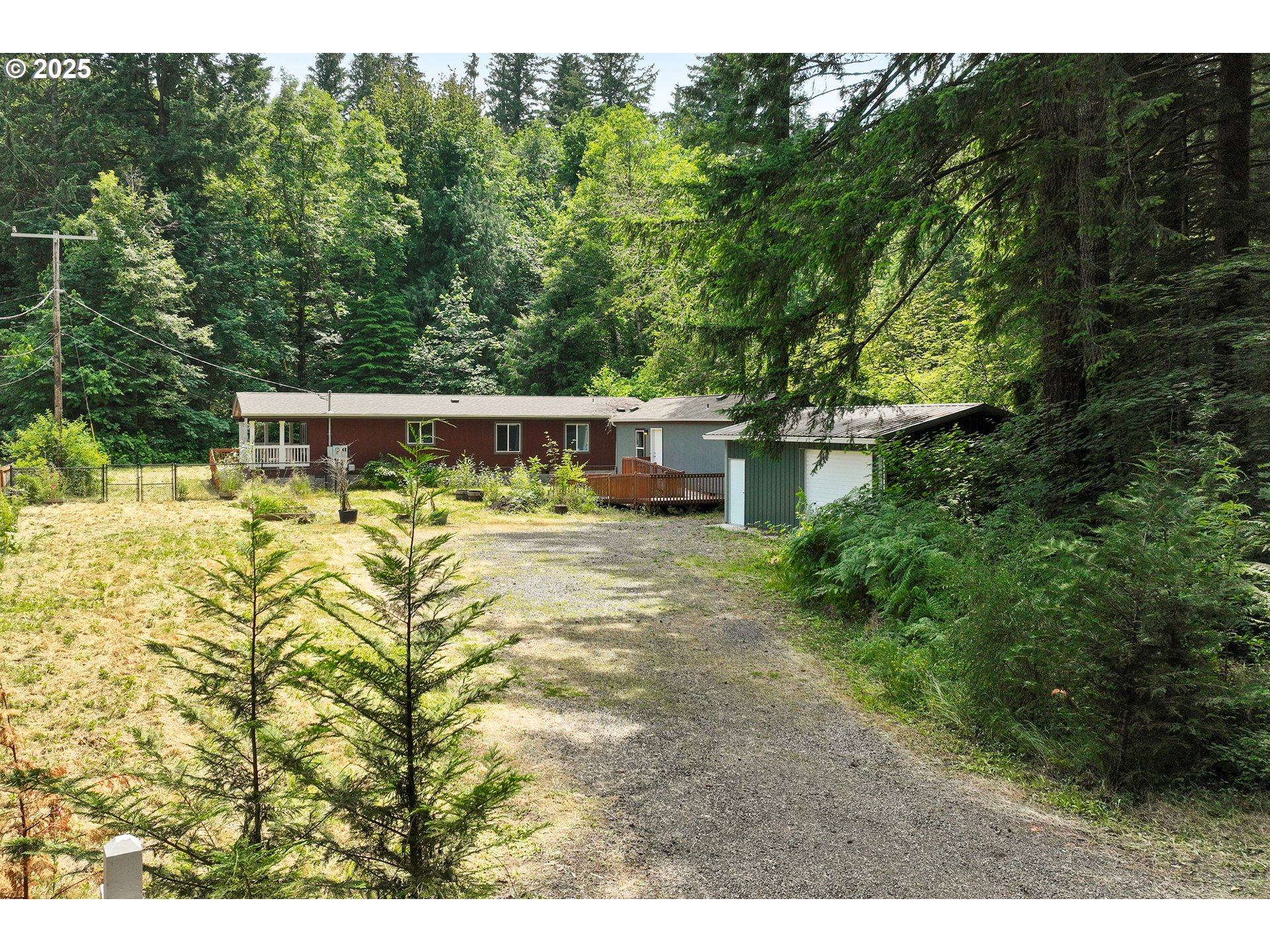 Just 6 miles from downtown Sandy, this versatile property offers over 1 acre of level land. The main home is a 1,440 sqft, 2BR, 2BA manufactured home with a bonus room & a spacious covered front porch. The primary suite includes a walk-in closet with organizers, walk-in shower, soaking tub & double sinks. A second 437 sqft, 1BR, 1BA manufactured home is conveniently located next to the main house. Both homes installed 2019 & have entry ramps. The property has a large insulated shop w/overhead door, electrical & shelving. Enjoy the fenced yard, extra big paver patio, raised garden beds w/drip lines & plenty of space for RV, boat or extra parking.