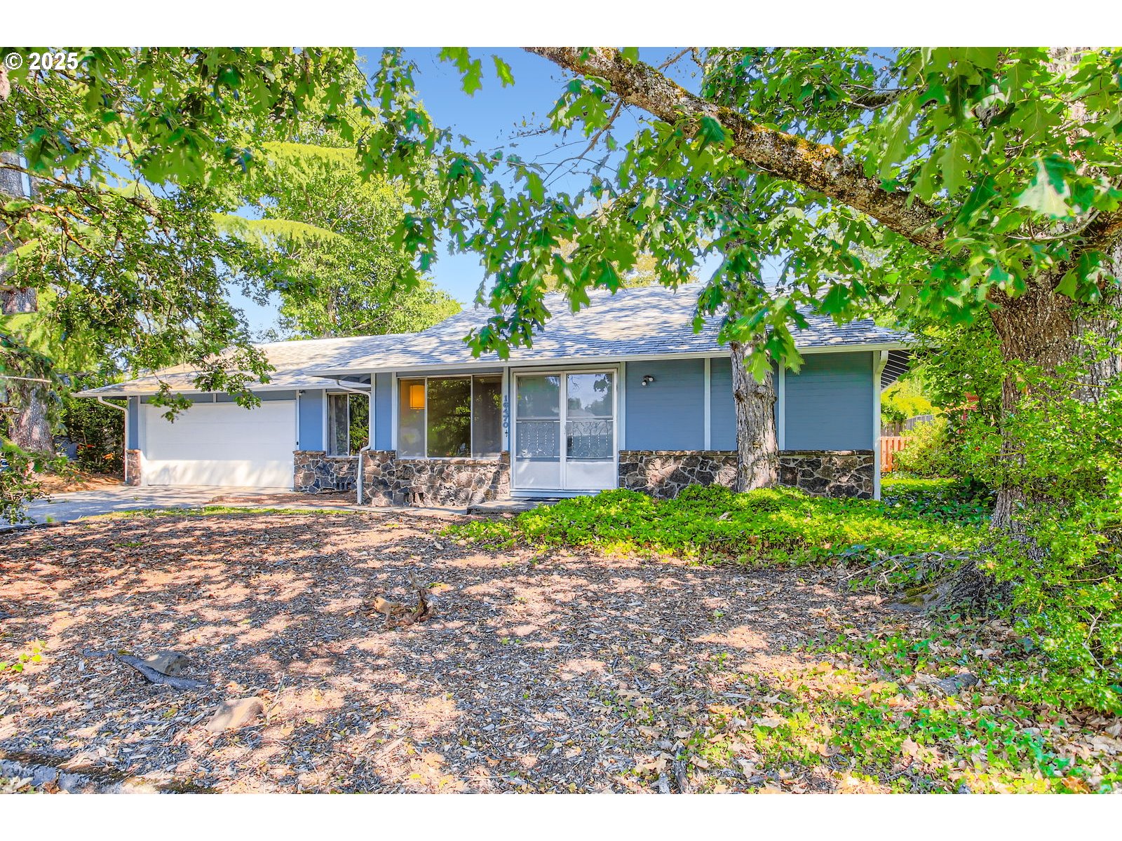 You’ll love the easy living of this single-level, well-maintained retro cutie in the super-desirable Oak Grove neighborhood. Nestled among the lush, tree-lined SE Concord, SE River Rd and Milwaukie’s beloved Trolley Trail, Sterling Circle feels like its own peaceful community. This little sugar is filled with sweet original elements, but also offers modern sensibility and opportunities to update and create your new nest. The versatile floor plan includes three bedrooms, a generous living room, and a large bonus room that could be a primary bedroom, an office, or a family room. Newer appliances in the kitchen, with sliding doors that invite the flow of backyard gatherings and barbecues on the deck. The low-maintenance yard is easy to love, with established landscaping and old growth trees. An oversized double-car attached garage provides tons of additional storage and room for toys. Enjoy excellent access to shopping, parks, and the Willamette river - plus, the Trolley Trail connects with the Springwater Corridor, offering a bike/pedestrian route to downtown Milwaukie and downtown Portland.