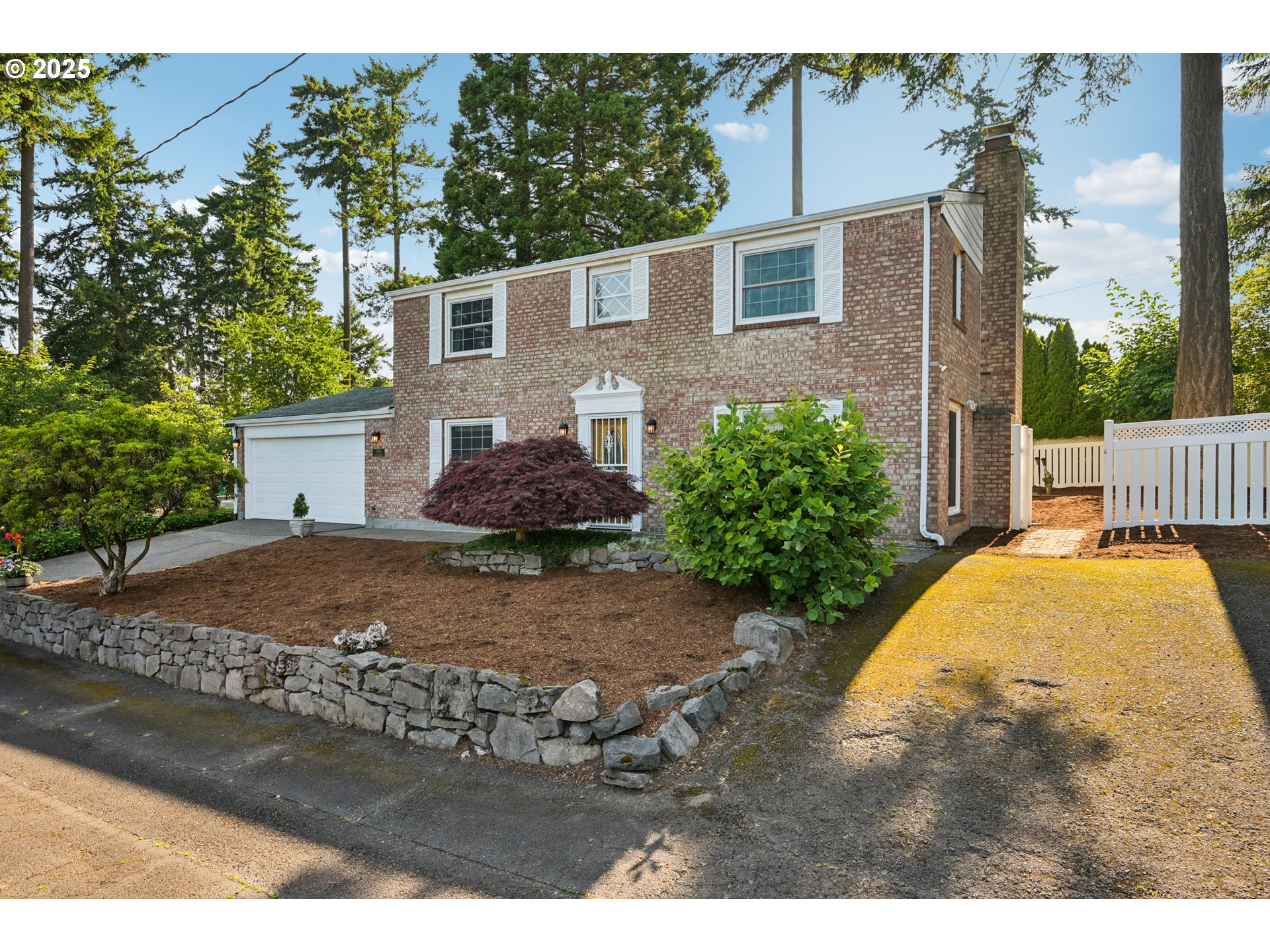 Welcome to this classic two-story brick Colonial, perfectly nestled on a quiet cul-de-sac in the heart of Mill Park. Situated on a generous 7,500 sq ft corner lot, this home combines timeless architecture with comfortable, modern living in a serene, private setting. Gracious Living Spaces: Step inside to a spacious and light-filled living and dining room, complete with a cozy gas fireplace and large picture windows that invite natural light throughout the day. Chef’s Kitchen: The heart of the home is the expansive, well-appointed kitchen featuring ample storage, a large pantry, generous counter space, and a sunny breakfast area—ideal for both daily living and entertaining. Flexible Floor Plan: A main-level bonus room or office offers the perfect flex space for remote work, hobbies, or guest use. Expansive Upstairs Retreat with fantastic views. The upper level includes a spacious primary suite with dual closets and an en suite bathroom, along with two additional generously sized bedrooms and a full hall bath—perfect for families or hosting guests. Outdoor Oasis: French doors lead from the kitchen to an extra-large, private fenced patio—a paved retreat ideal for year-round entertaining, fire pit gatherings, or simply enjoying the peace and quiet. The backyard features room for gardening, play, or pets amid the natural beauty of old-growth trees. Additional Highlights: Large attached garage with separate storage room Second driveway perfect for RV or boat parking. Minutes to Montavilla, Mt. Tabor, Floyd Light Park, East Portland Community Center, Adventist Health, I-205, shopping, dining, and more. Tucked into an established neighborhood with mature landscaping and a strong sense of community, this stately home blends classic charm with everyday functionality. Come explore the possibilities and make this Mill Park gem your forever home! [Home Energy Score = 5. HES Report at https://rpt.greenbuildingregistry.com/hes/OR10239220]