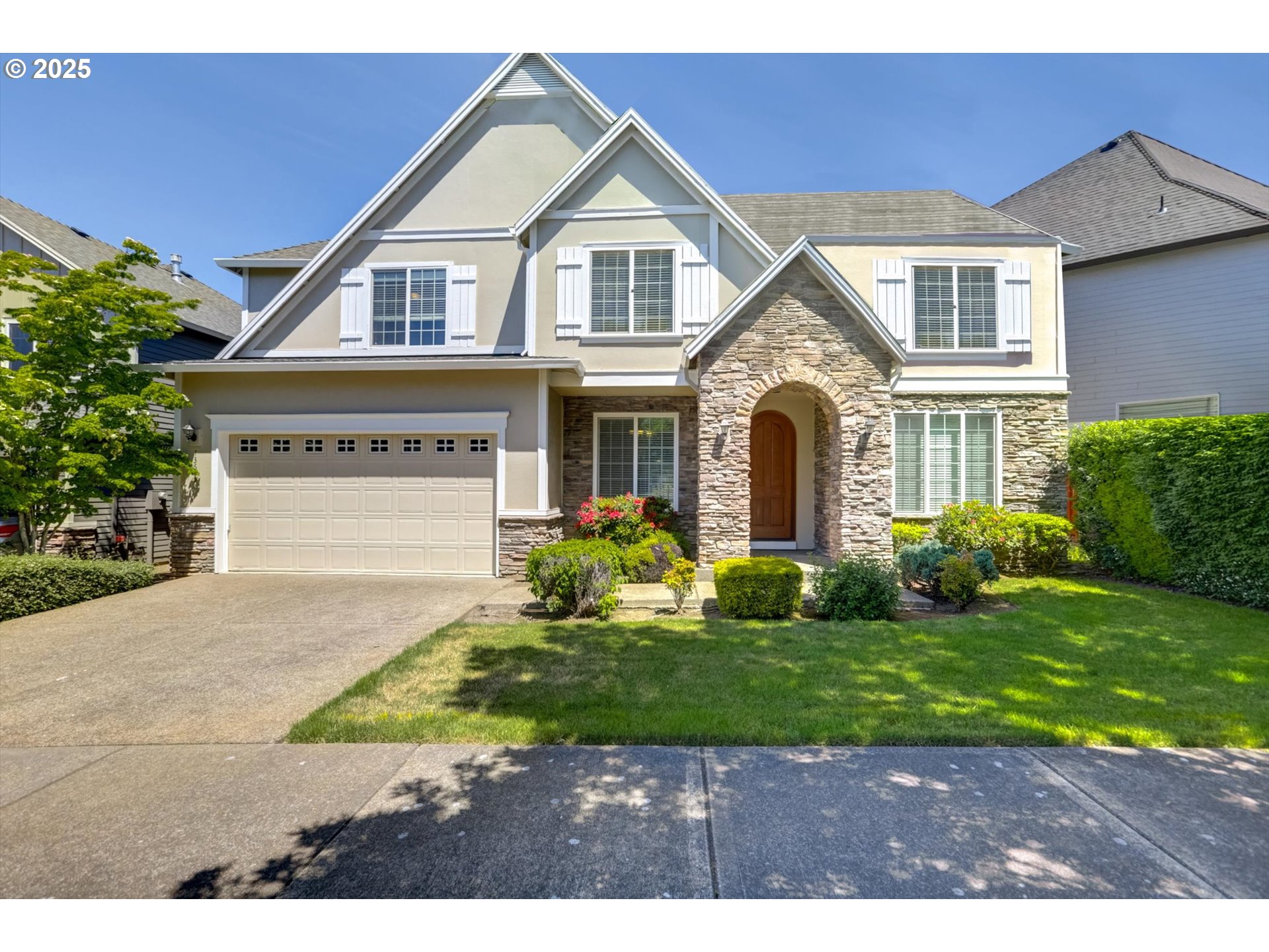 Spacious and versatile 5-bedroom, 3-bath home in the desirable Bethany neighborhood, offering 2,718 square feet of comfortable living. Thoughtfully designed with a full bedroom and bath on the main level — perfect for guests, a home office, or creative space.The heart of the home features high ceilings and an open-concept layout that seamlessly connects the family room, dining area, and kitchen. Enjoy hardwood floors, granite countertops, and stainless steel appliances, all framed by warm wood cabinetry and a functional island for everyday gatherings or entertaining.Upstairs, you'll find generously sized bedrooms, including a spacious bonus room ideal for a media/game room or flex space. The primary suite offers a peaceful retreat with a coffered ceiling, large walk-in closet, soaking tub, walk-in shower, and dual vanities.Step outside to a private backyard perfect for relaxing or entertaining. A freshly painted 3-car garage adds storage flexibility and curb appeal. This move-in-ready home is located in a walkable, bike-friendly community with sidewalks throughout and access to top-rated schools, including nearby Findley Elementary just a short walk away.Enjoy quick commutes to Nike, Intel, the airport, and downtown Portland. A perfect blend of comfort, location, and convenience in one of Portland’s most sought-after neighborhoods.